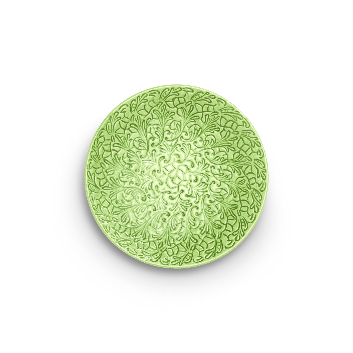 Green decorative plate with intricate patterns on a white background
