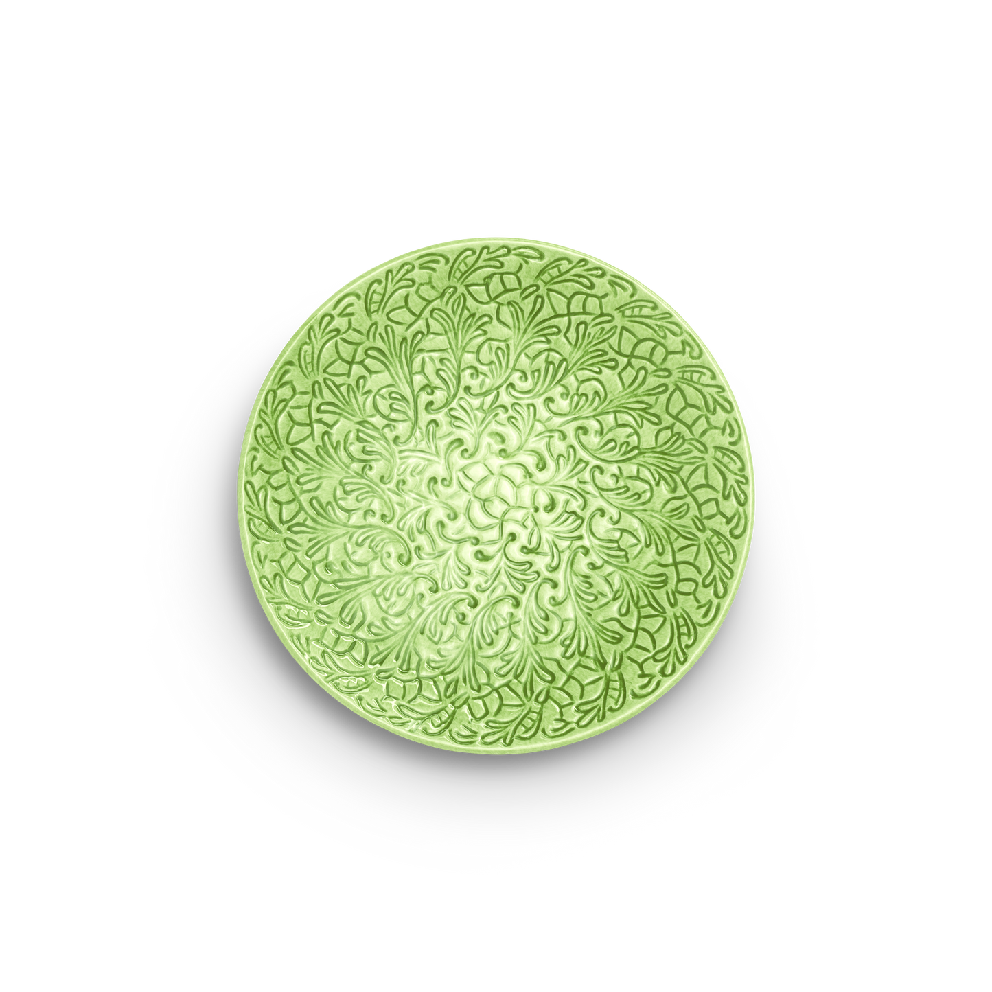 Green decorative plate with intricate patterns on a white background