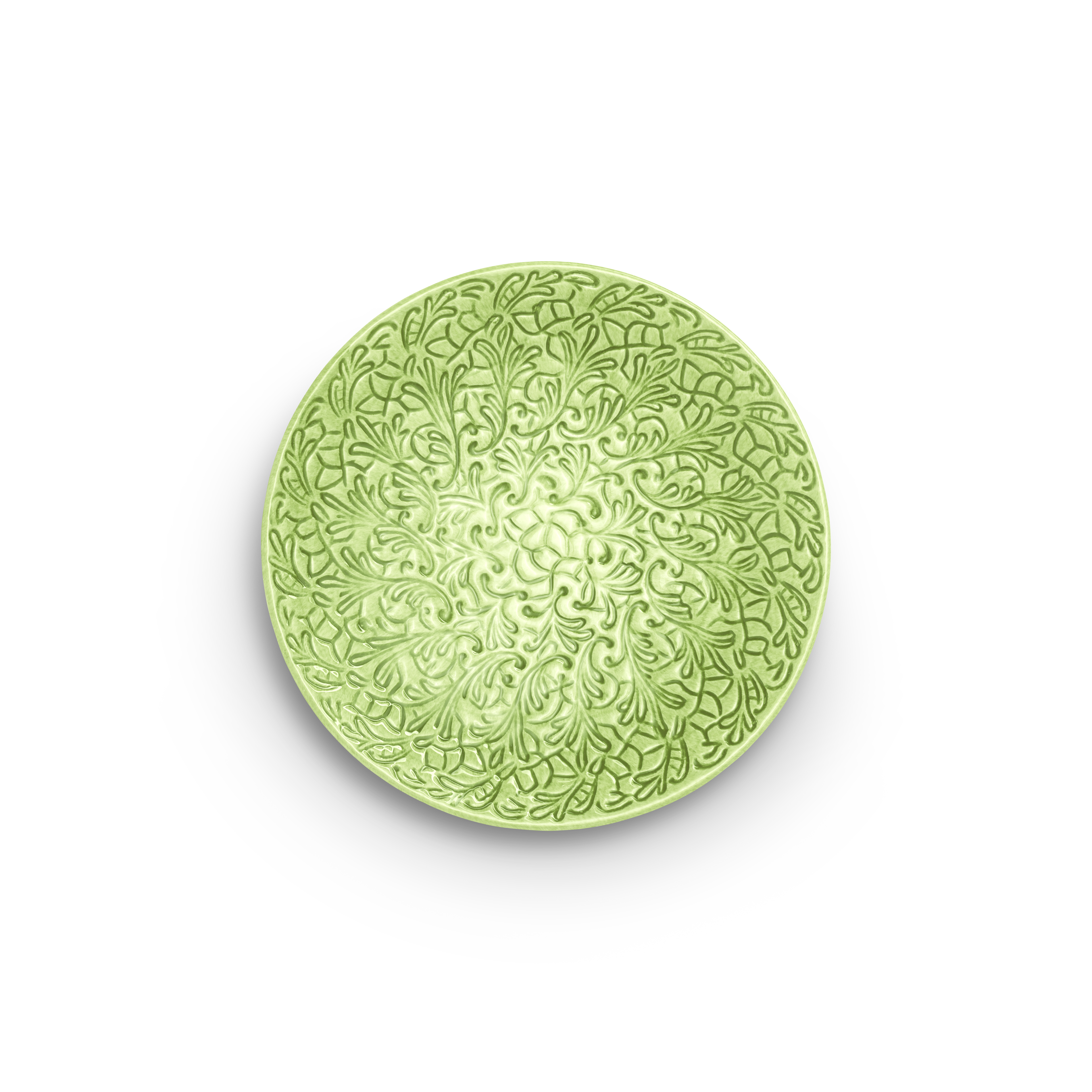 Green decorative plate with intricate patterns on a white background
