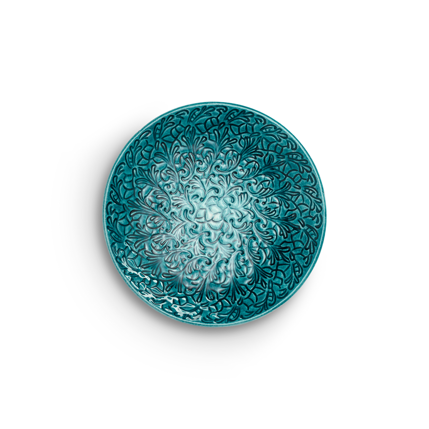 Decorative teal ceramic plate with intricate patterns on a white background