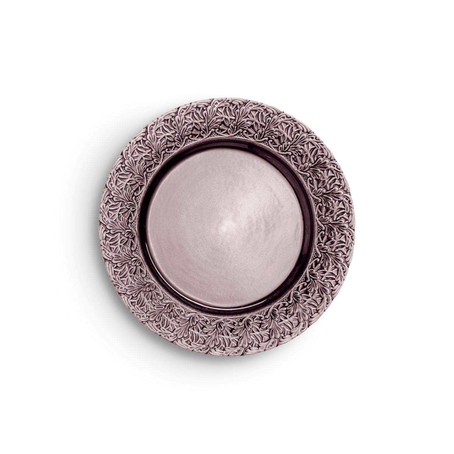 Decorative round metal object with intricate patterns on a white background