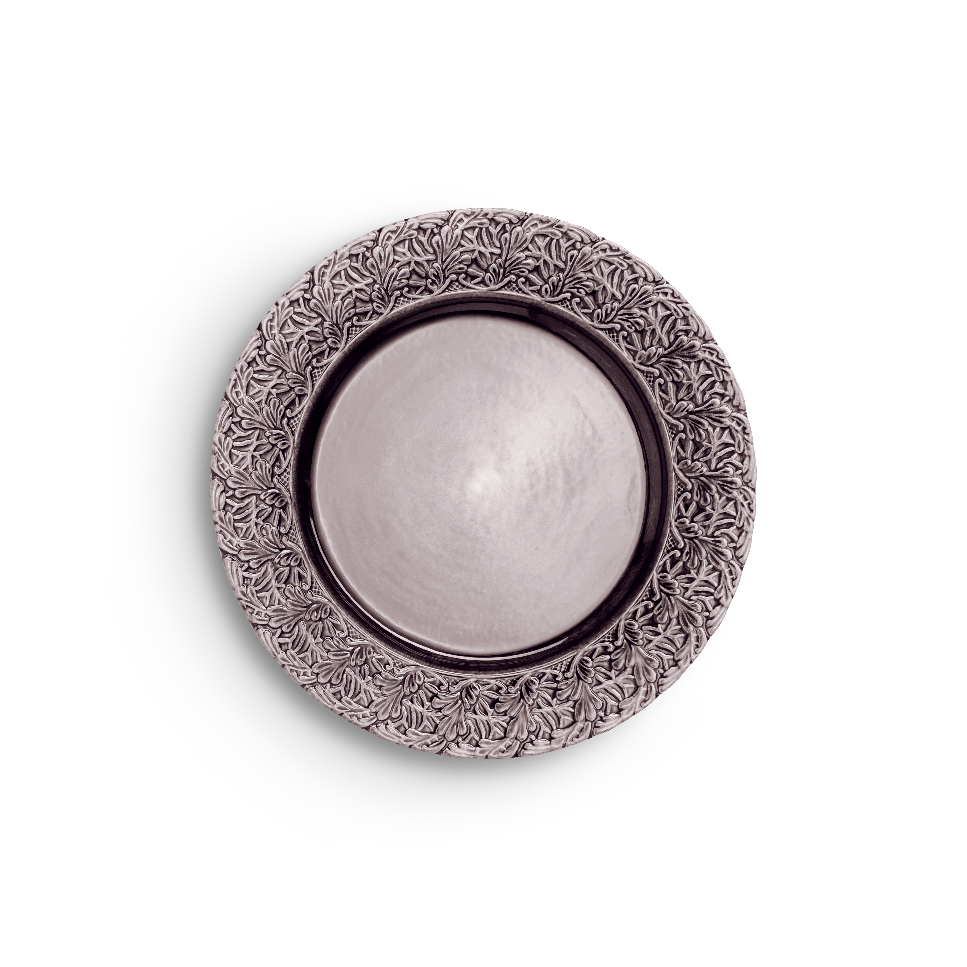 Decorative round metal object with intricate patterns on a white background