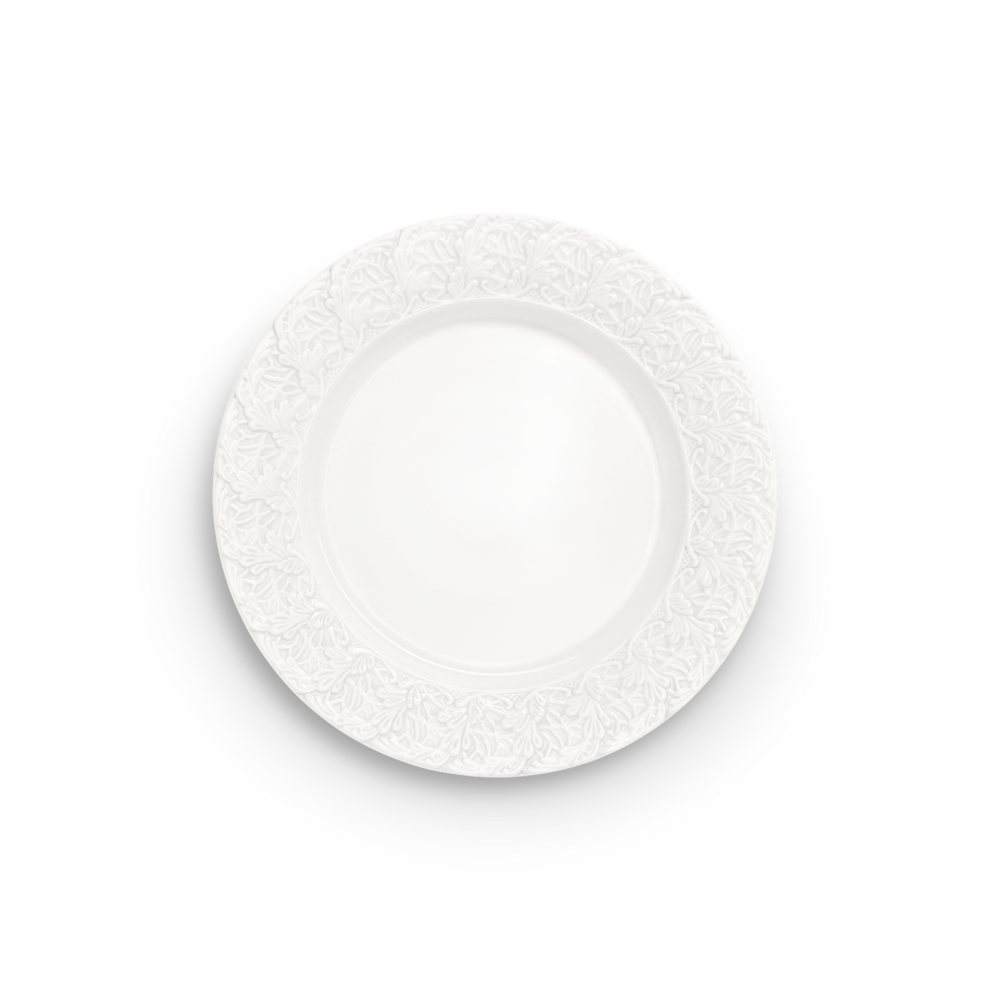 Decorative white plate with intricate lace pattern on a white background