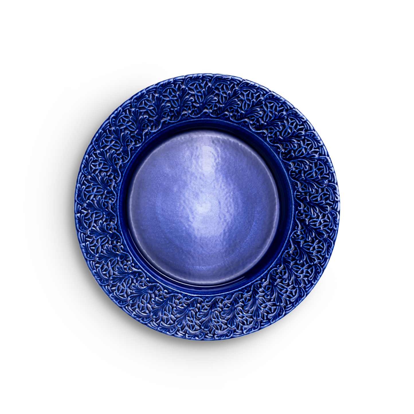 Blue ceramic plate with intricate patterns on a white background