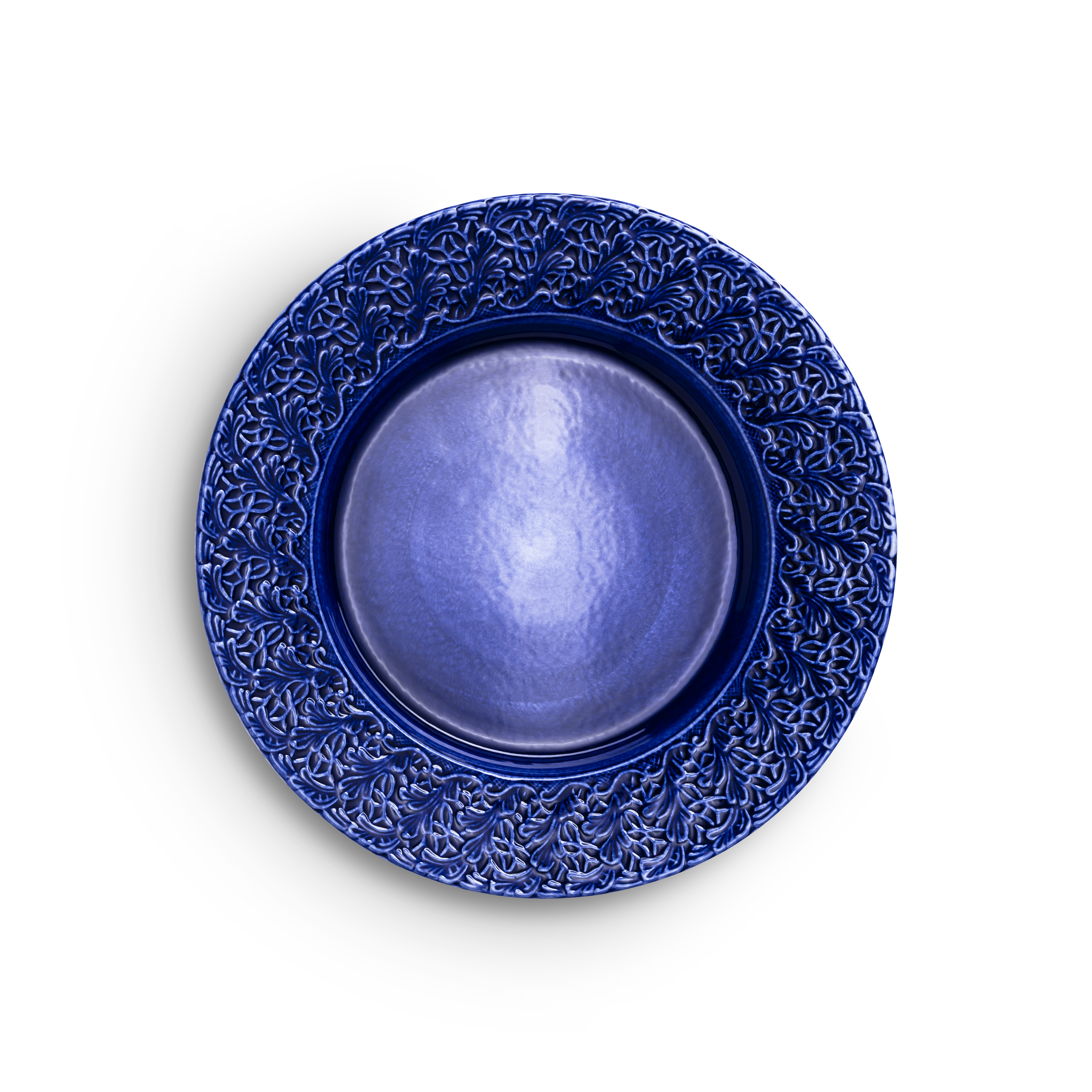 Blue ceramic plate with intricate patterns on a white background
