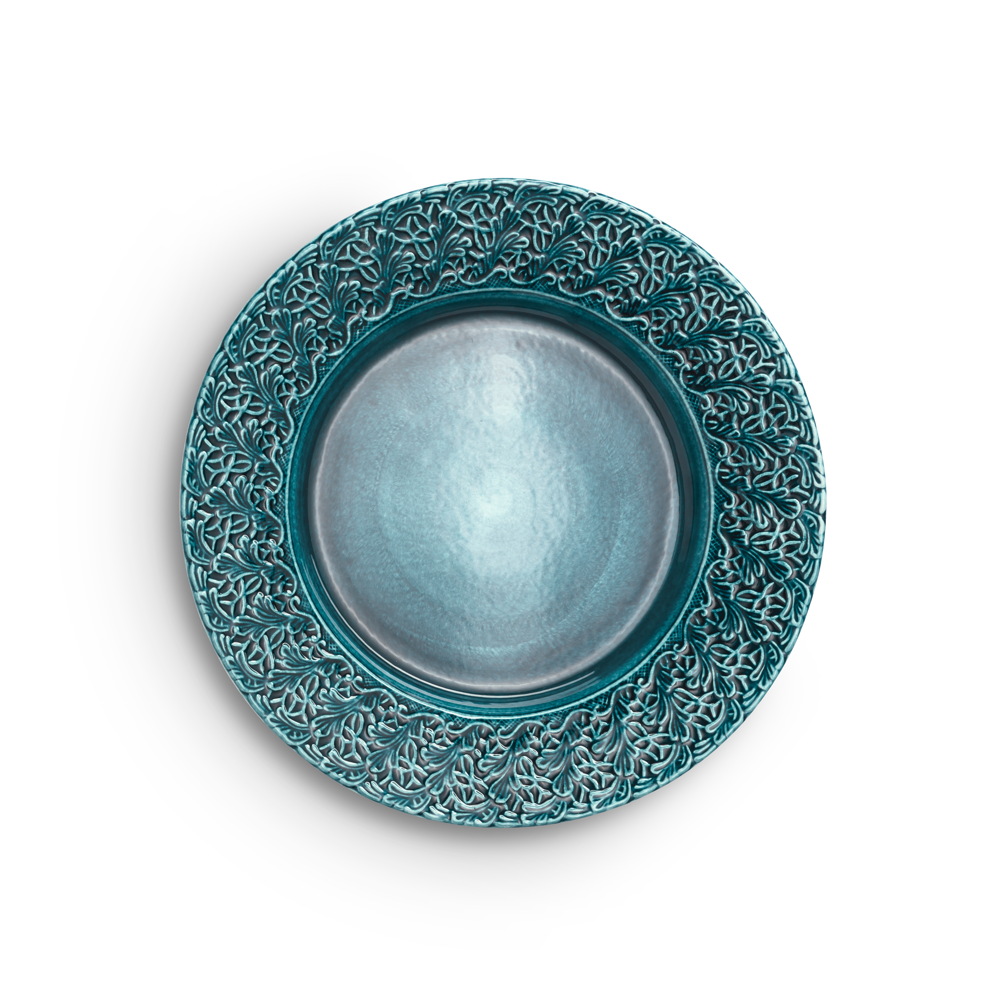 Teal ceramic plate with intricate patterns on a white background