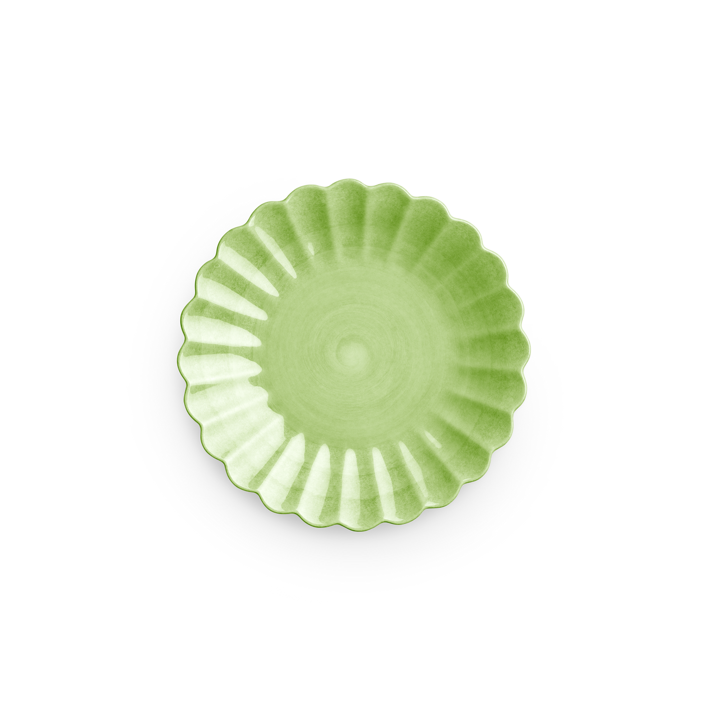 Green ceramic plate with decorative edge on a white background