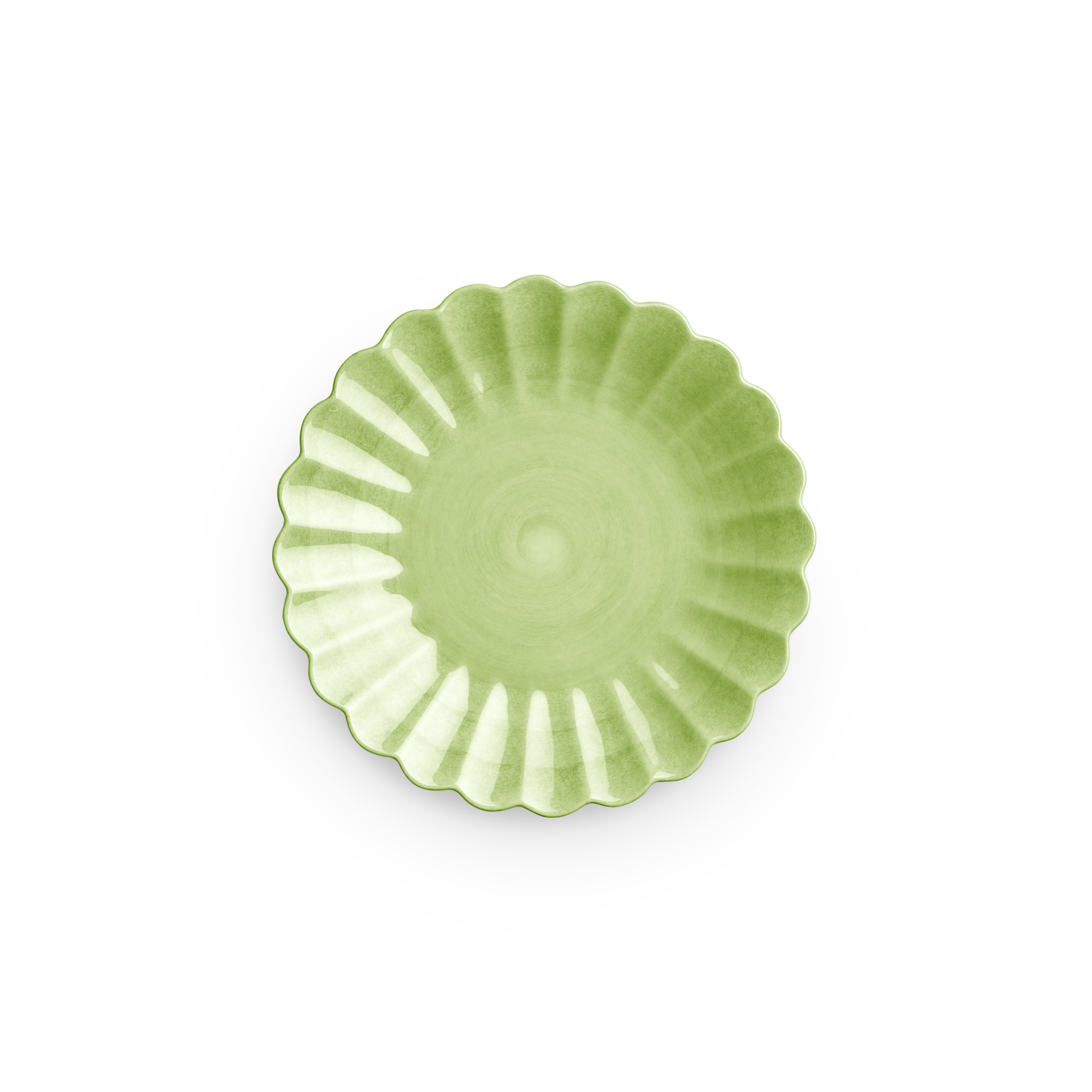 Green ceramic plate with decorative edge on a white background