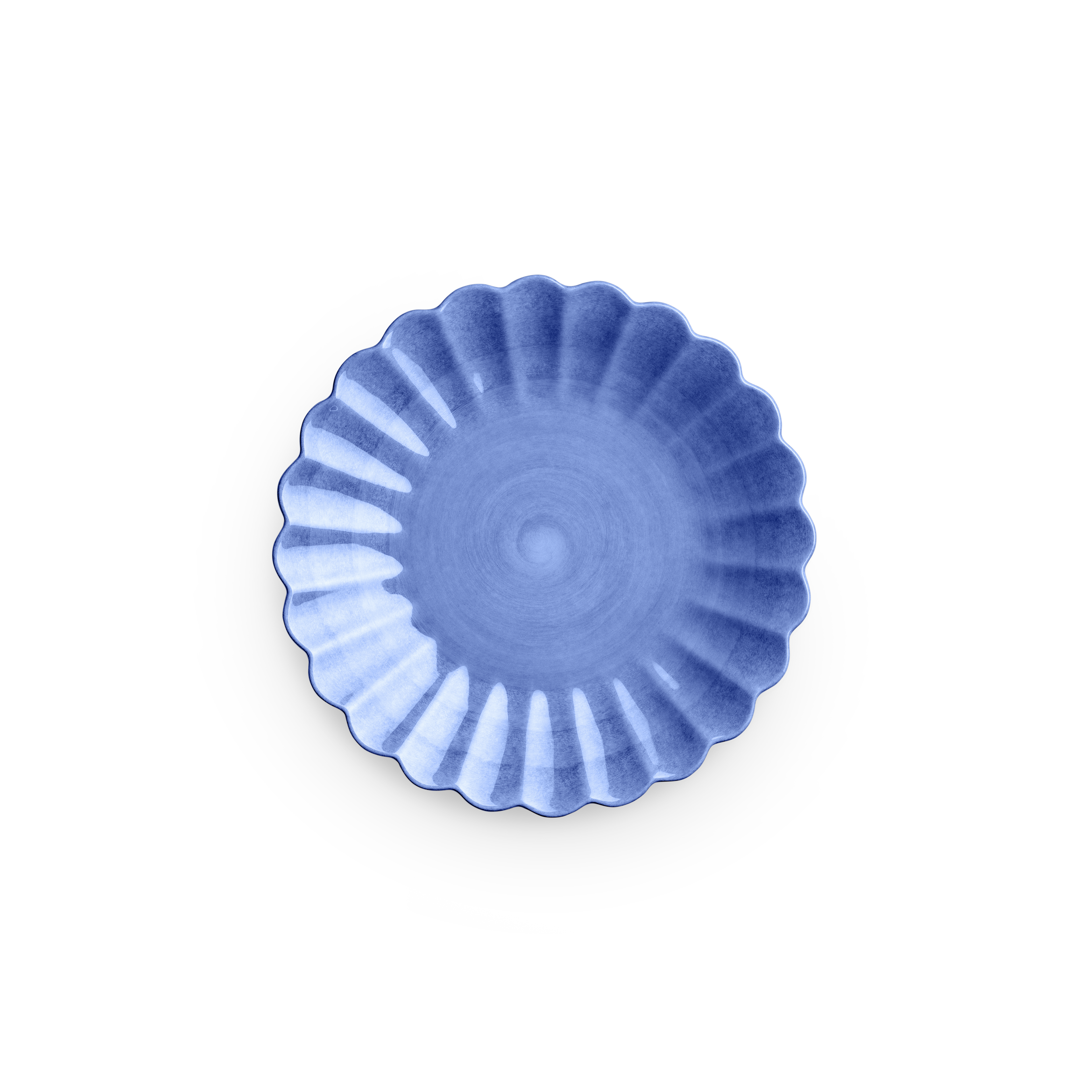 Blue ceramic dish with a scalloped edge on a white background