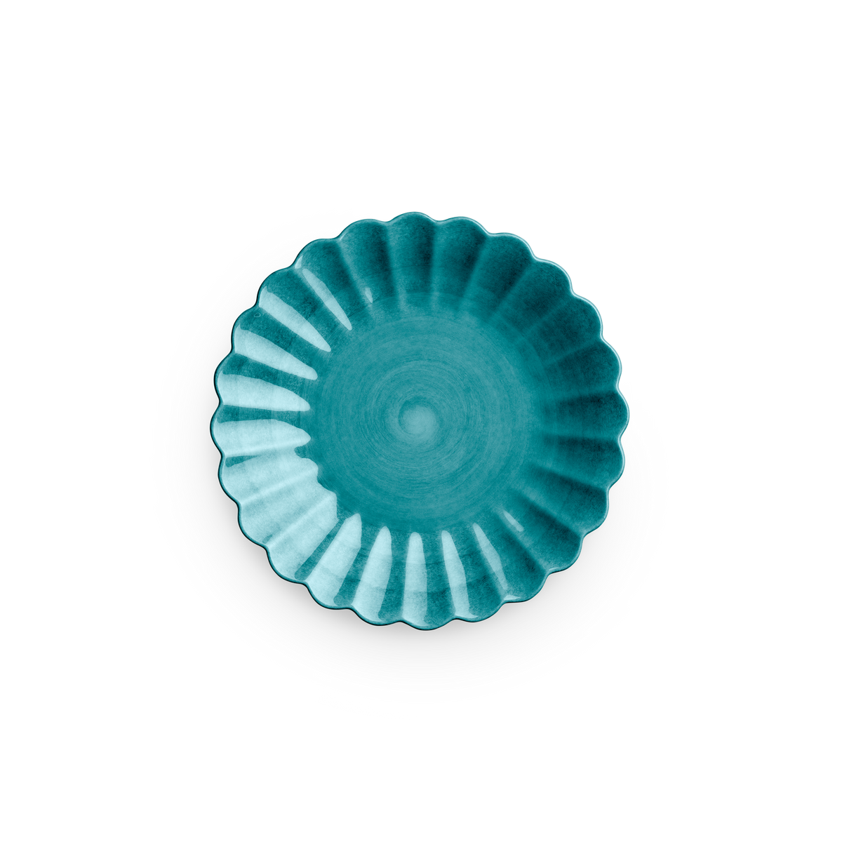 Teal ceramic dish with scalloped edge on a white background