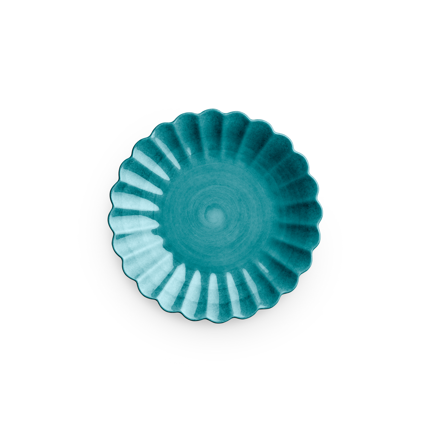 Teal ceramic dish with scalloped edge on a white background