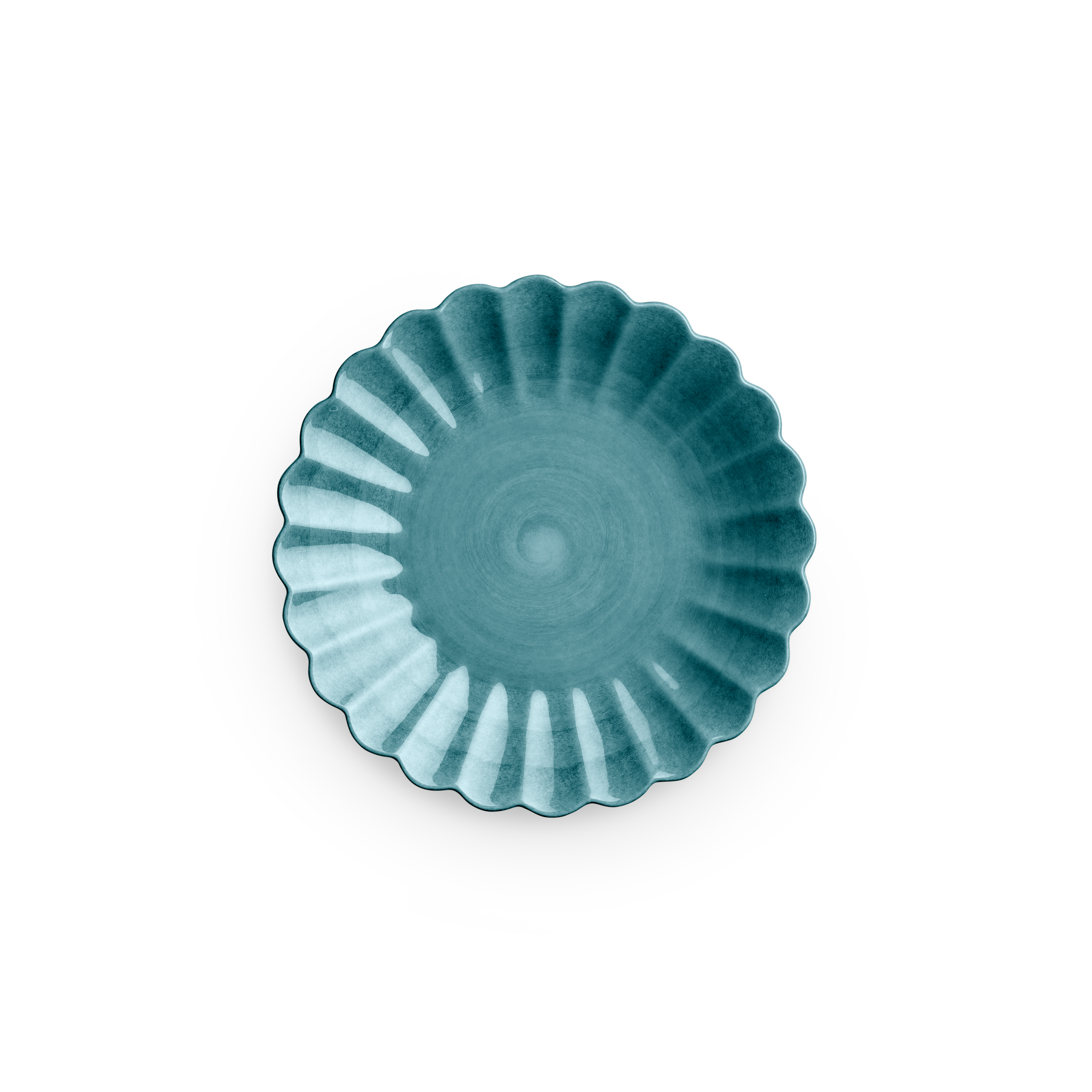 Teal ceramic dish with scalloped edge on a white background