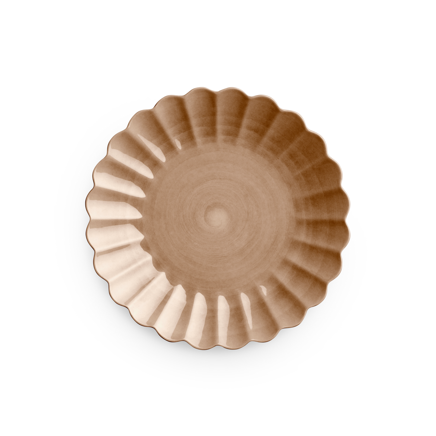 Decorative brown plate with scalloped edge on a white background