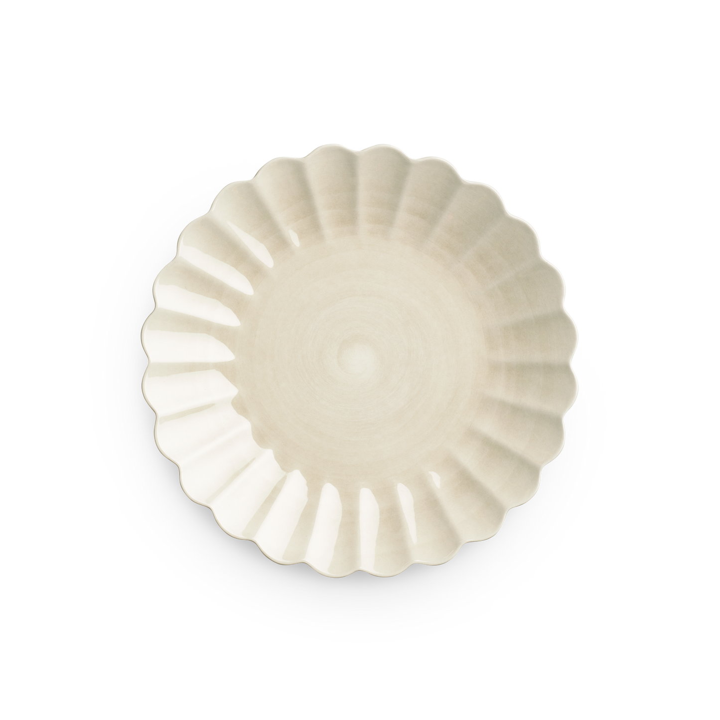 Decorative white plate with scalloped edge on a white background