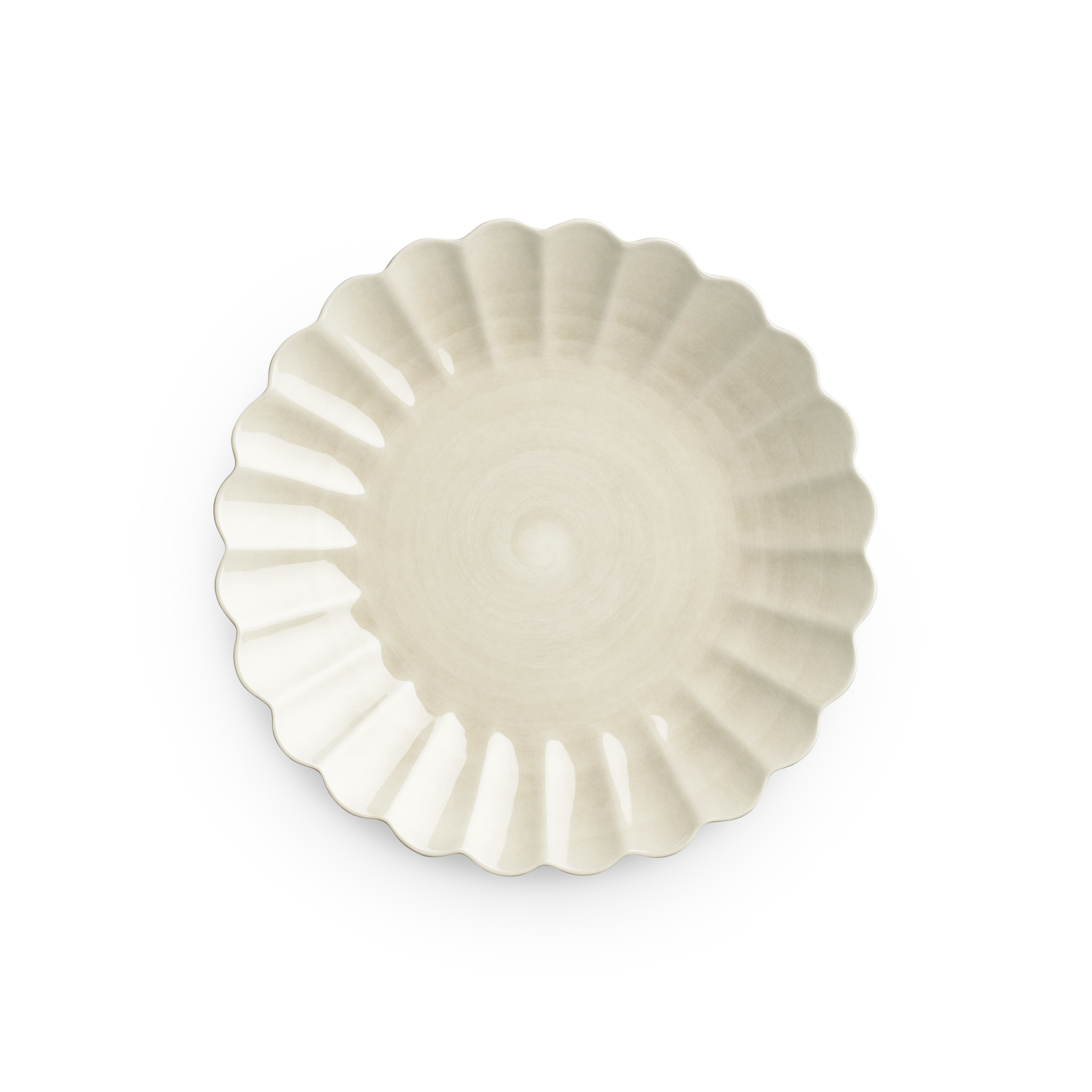 Decorative white plate with scalloped edge on a white background
