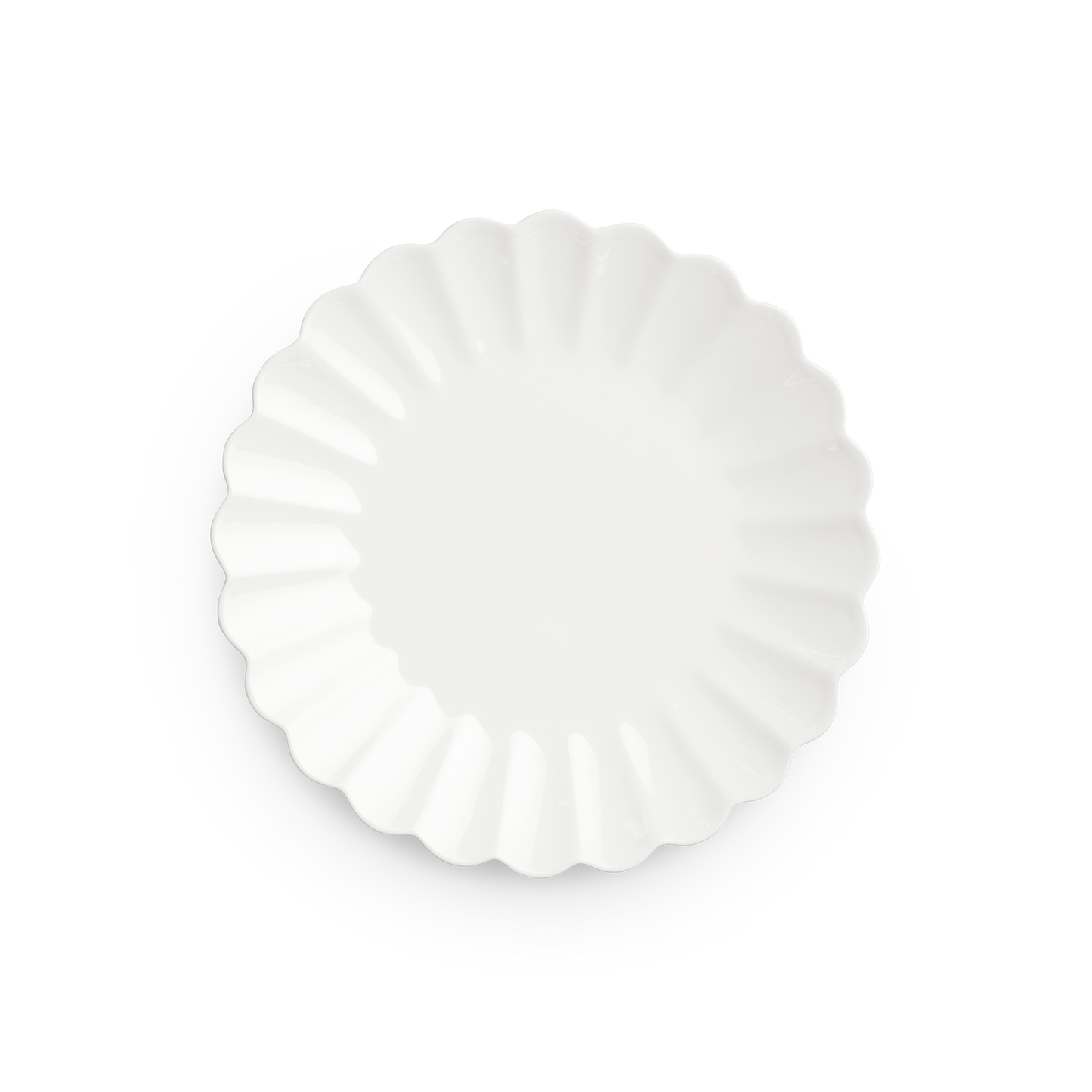 Decorative white plate with scalloped edge on a white background