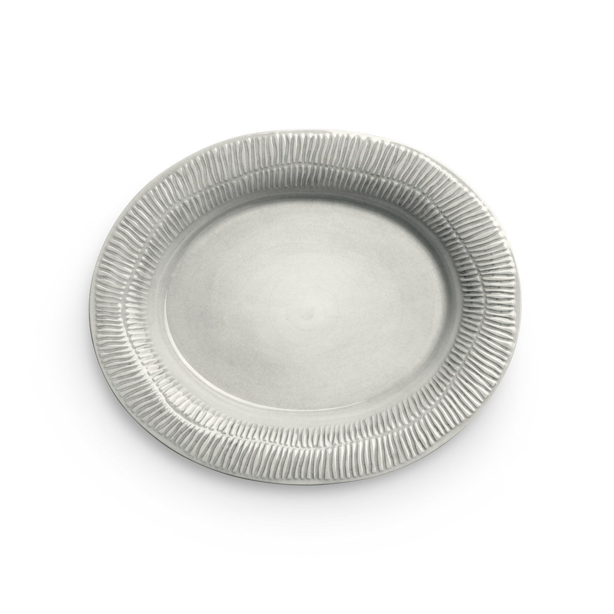 Beige ceramic plate with textured rim on a white background