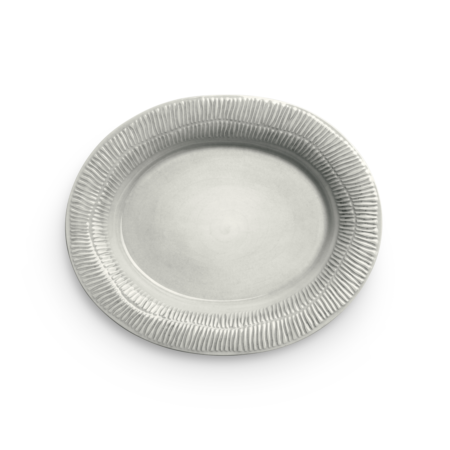 Beige ceramic plate with textured rim on a white background