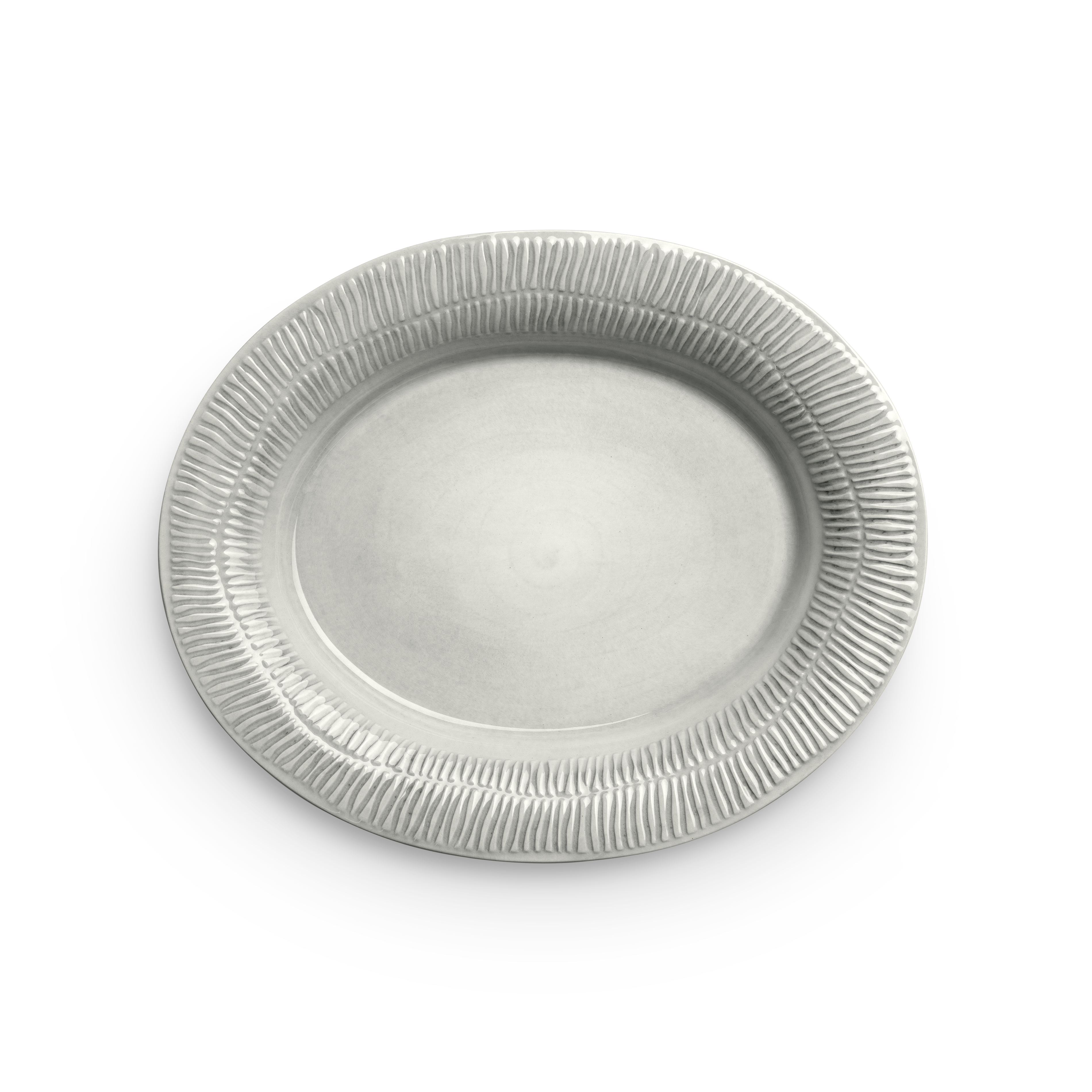 Beige ceramic plate with textured rim on a white background