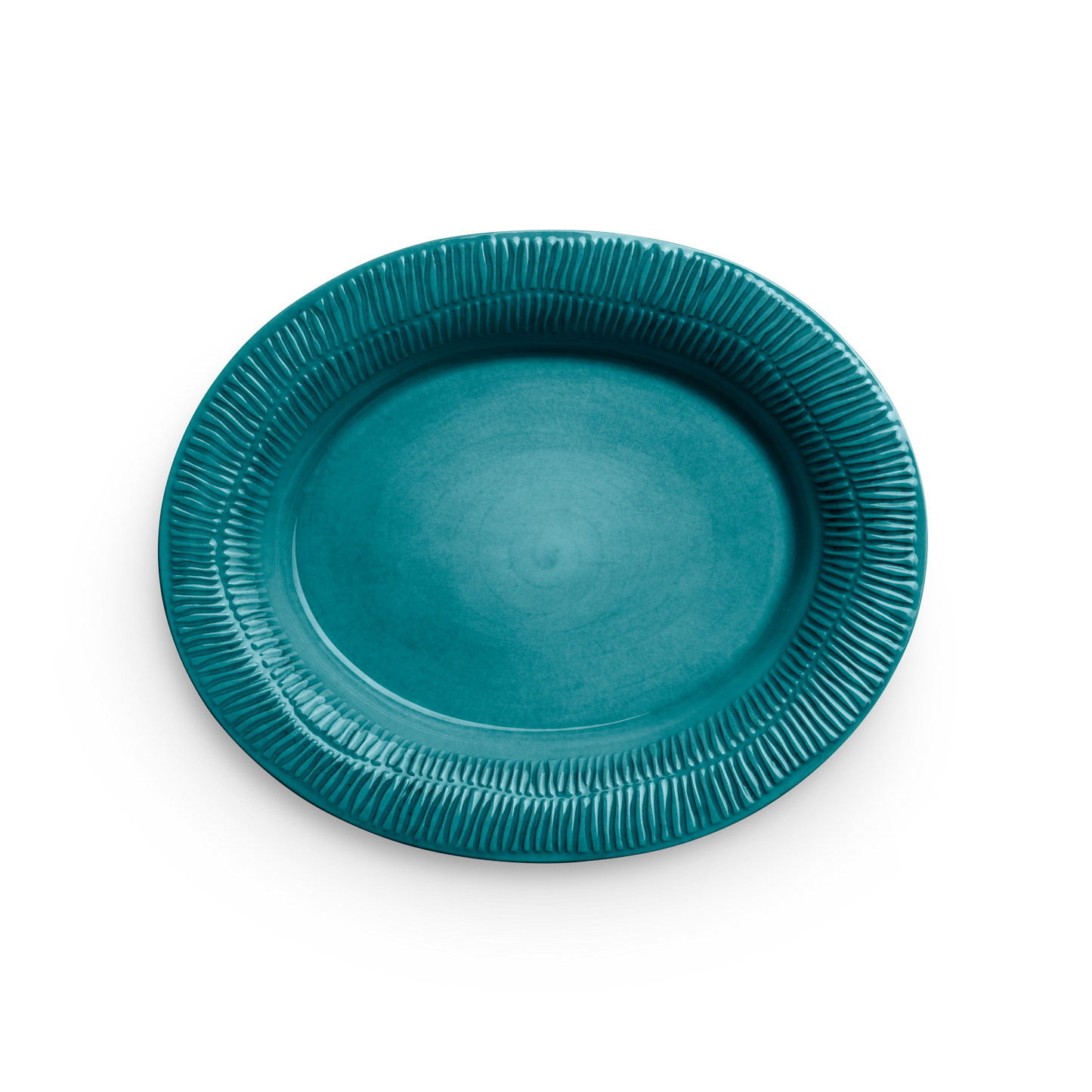 Teal ceramic plate with textured rim on a white background