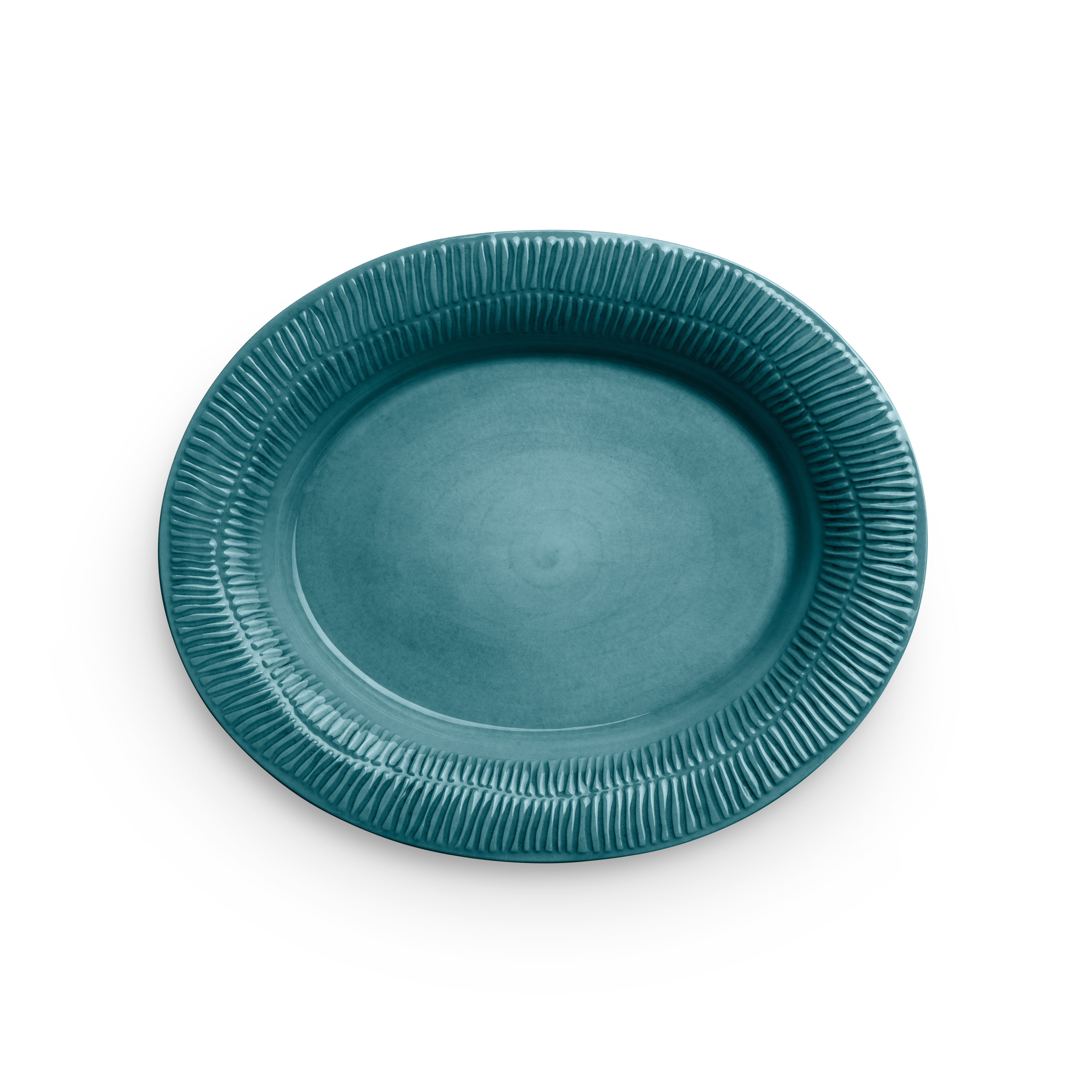 Teal ceramic plate with textured rim on a white background