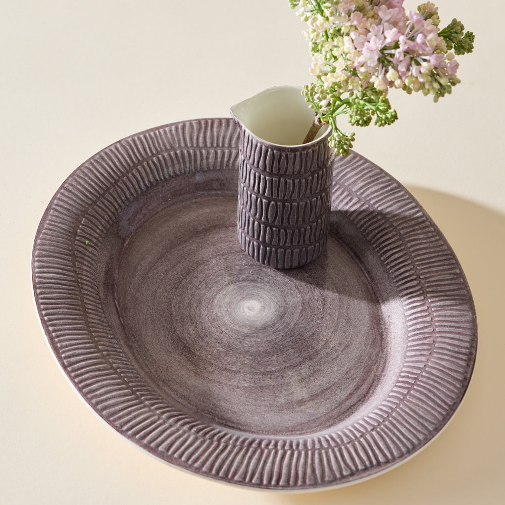 Ceramic plate with textured design on a light background