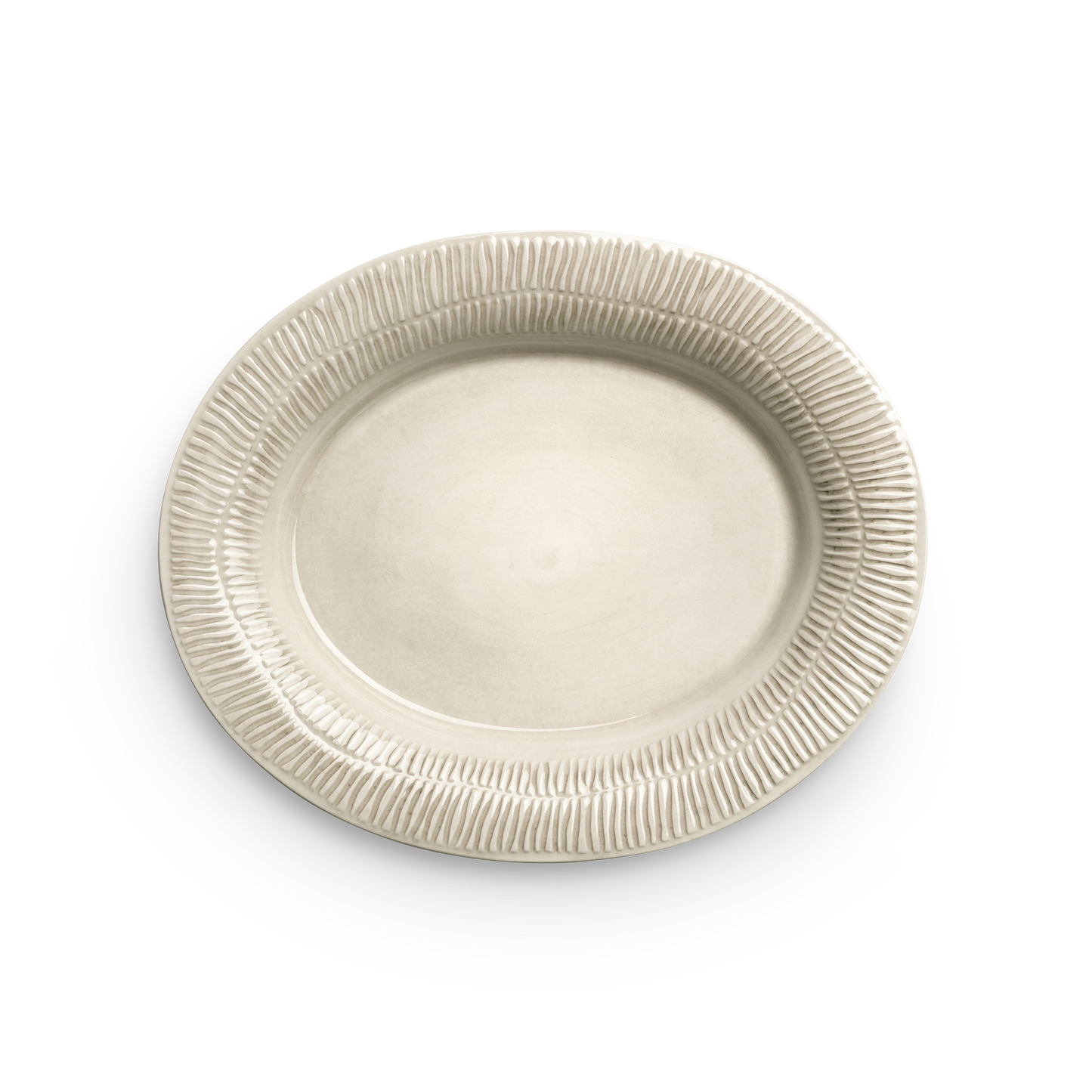 Beige ceramic plate with textured rim on a white background