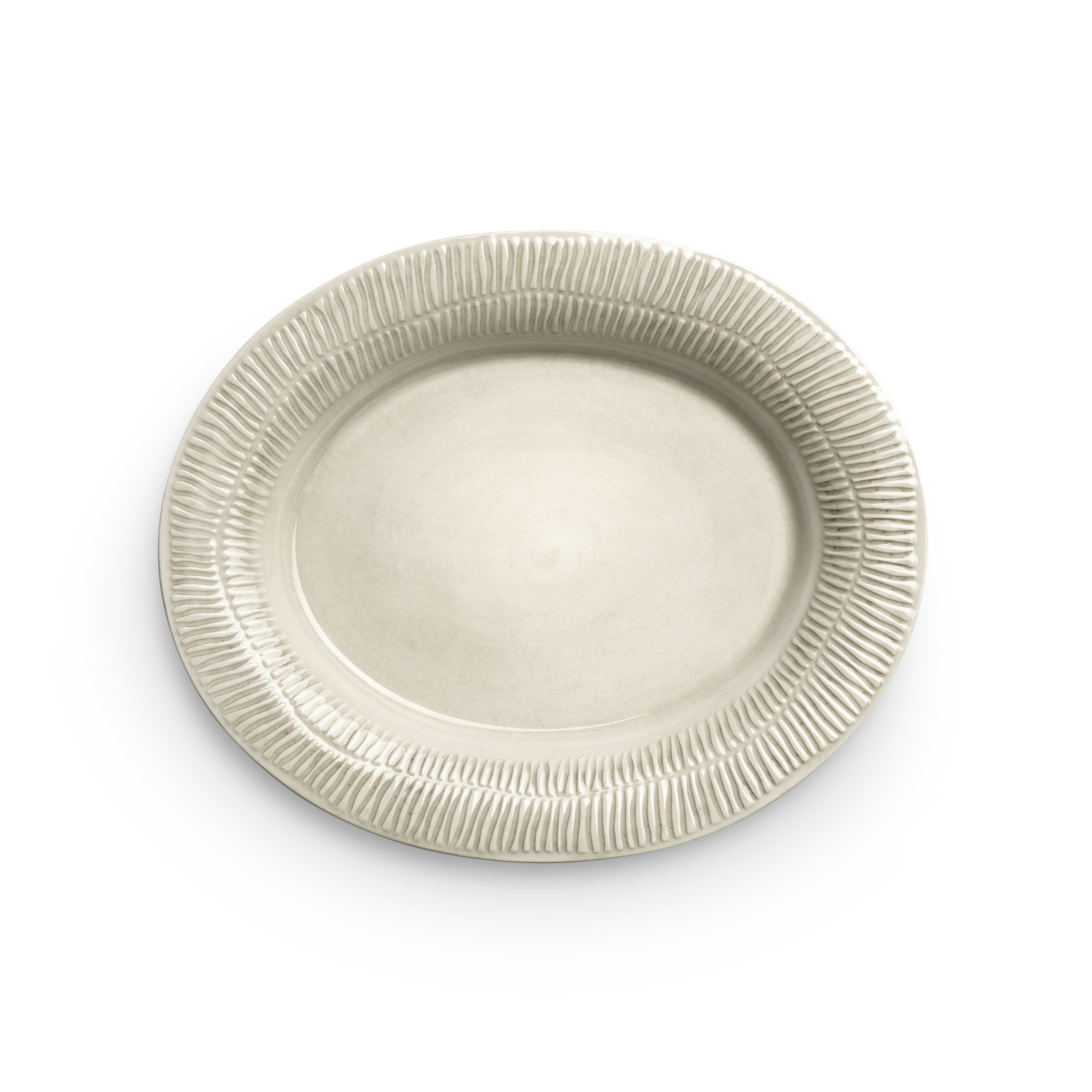Beige ceramic plate with textured rim on a white background