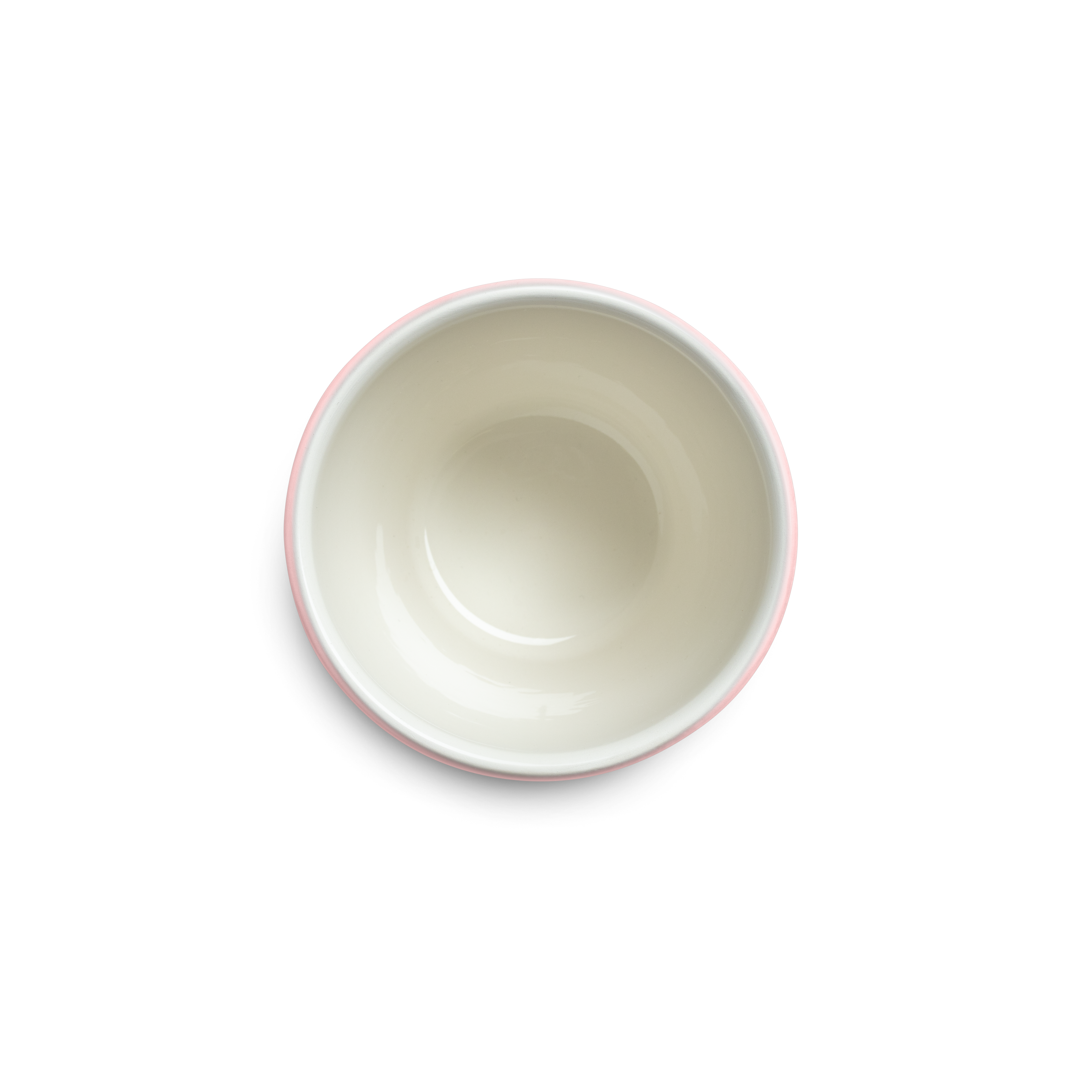 Pink textured ceramic cup from above against a white background