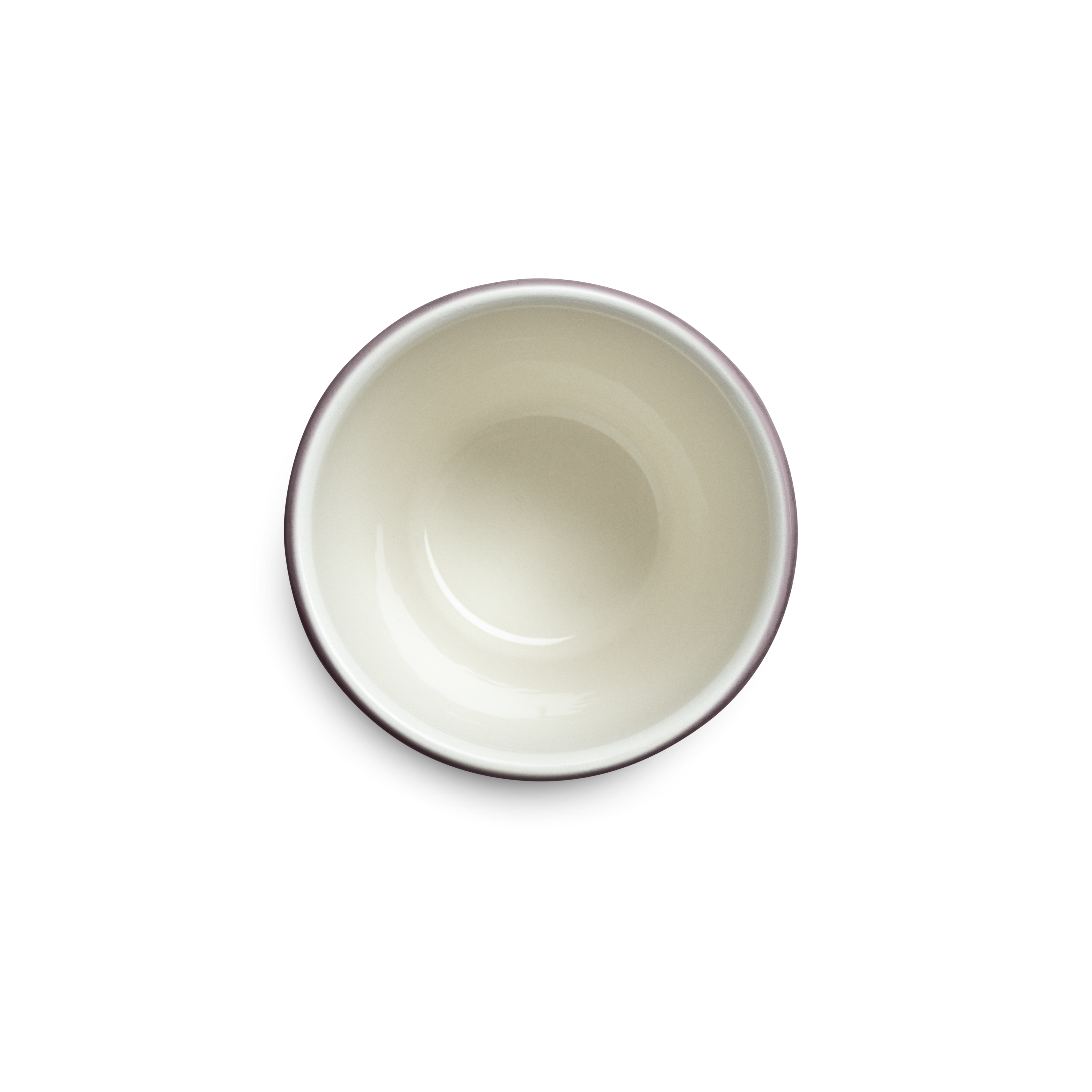 textured ceramic cup from above against a white background