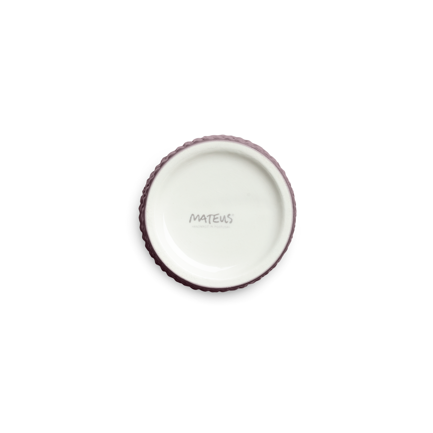 textured ceramic cup bottom against a white background