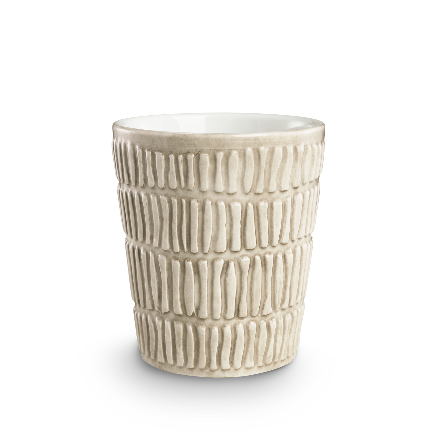 Textured ceramic cup on a white background