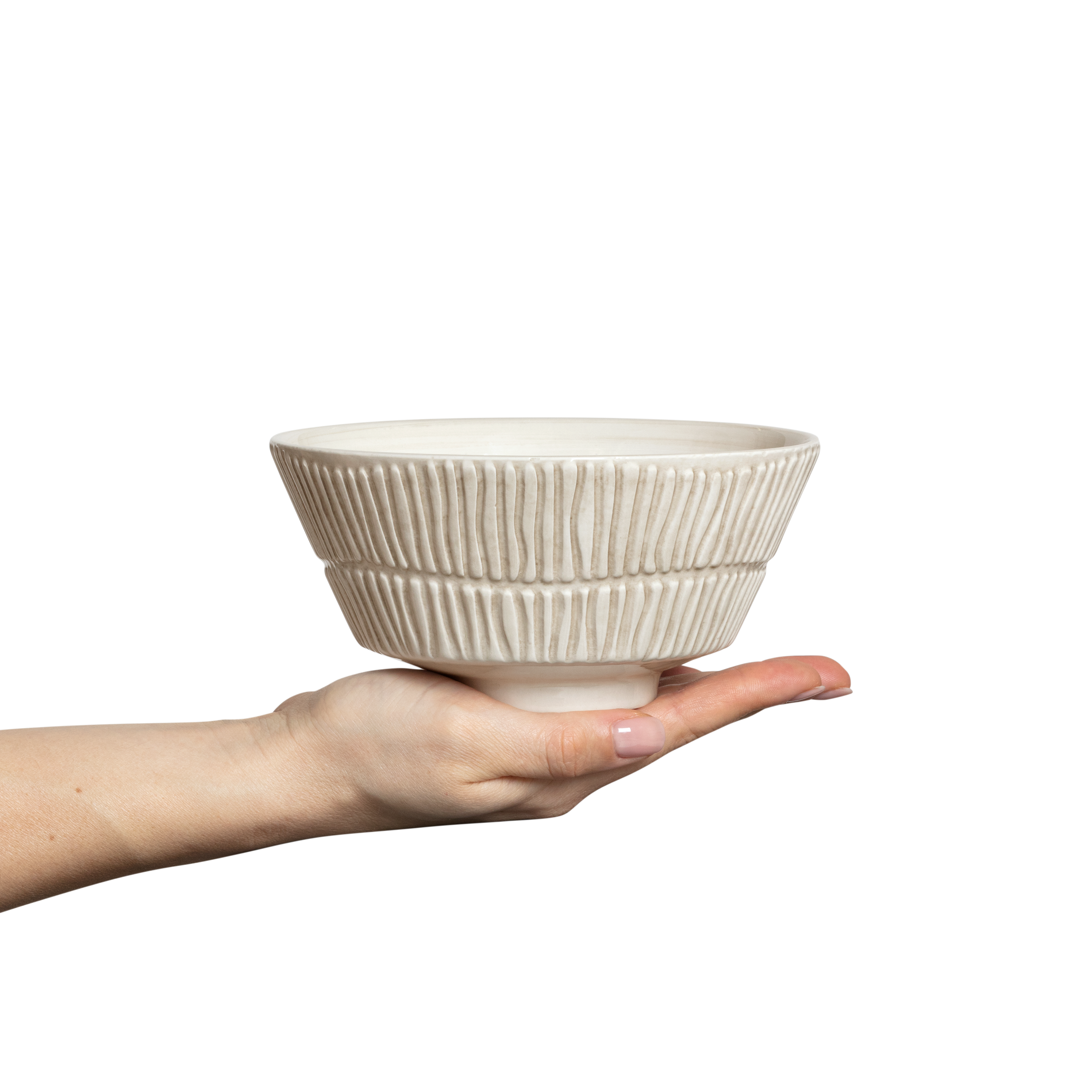 Hand holding a textured ceramic bowl against a white background