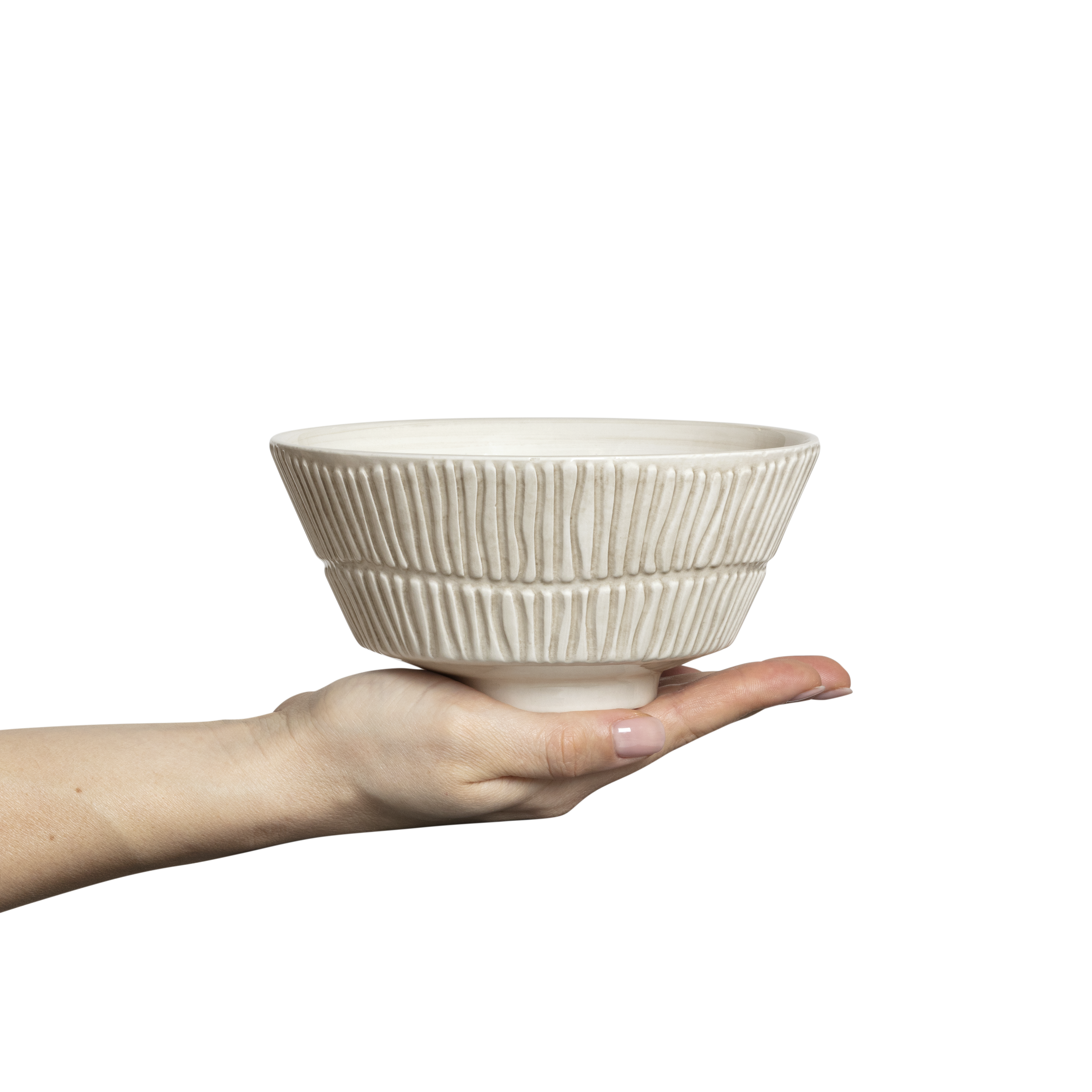 Hand holding a textured ceramic bowl against a white background