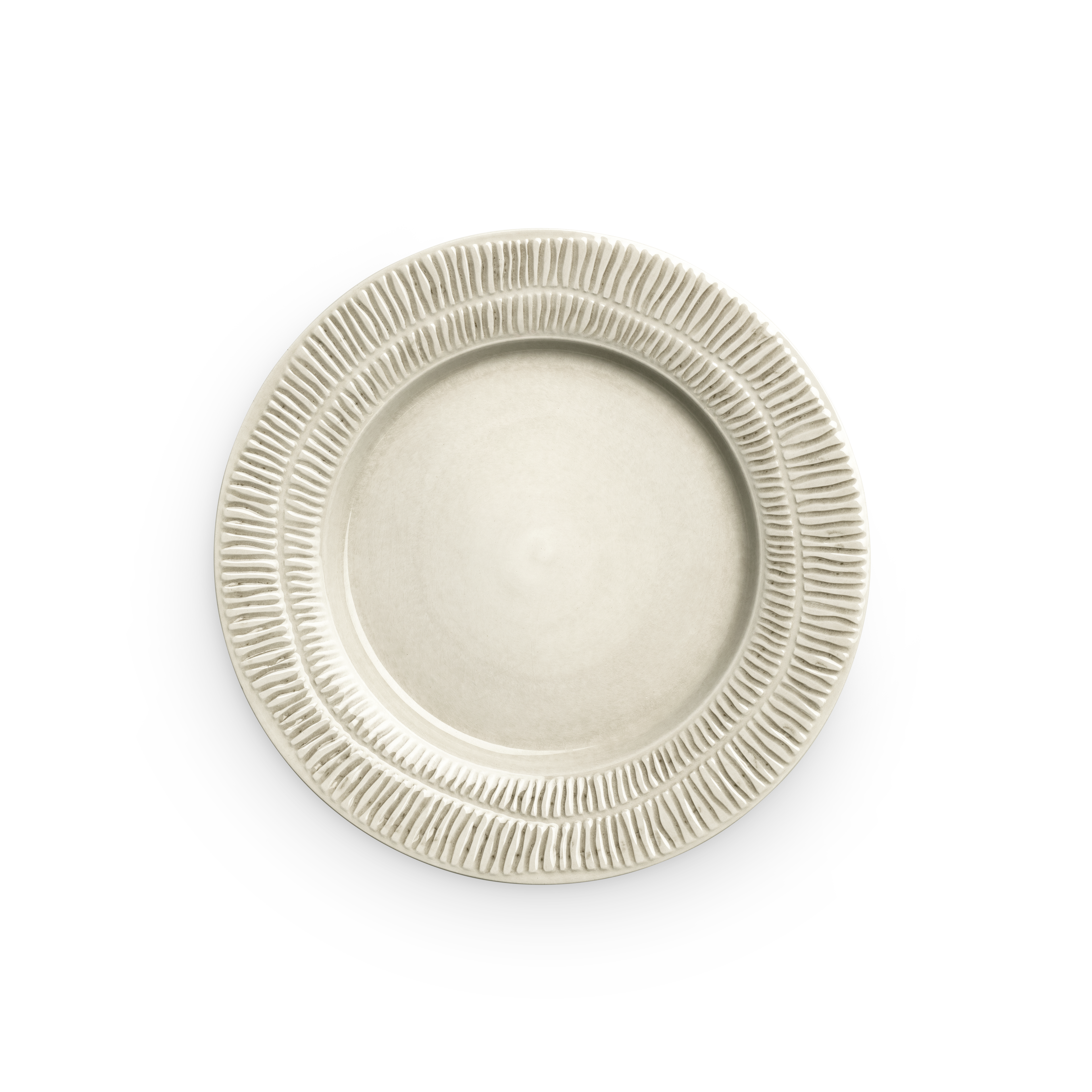 Beige ceramic plate with textured rim on a white background