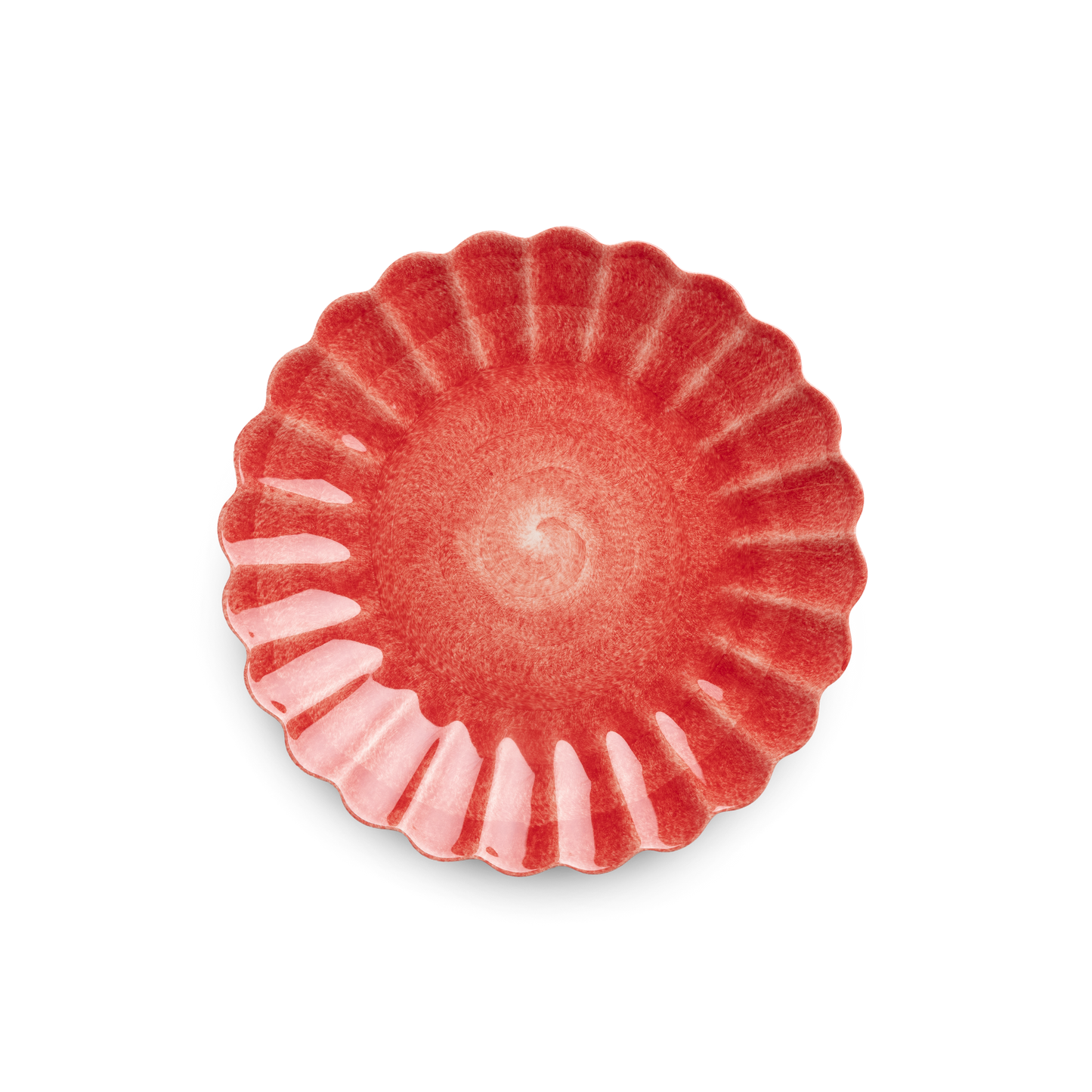 Red ceramic plate with scalloped edge on a white background