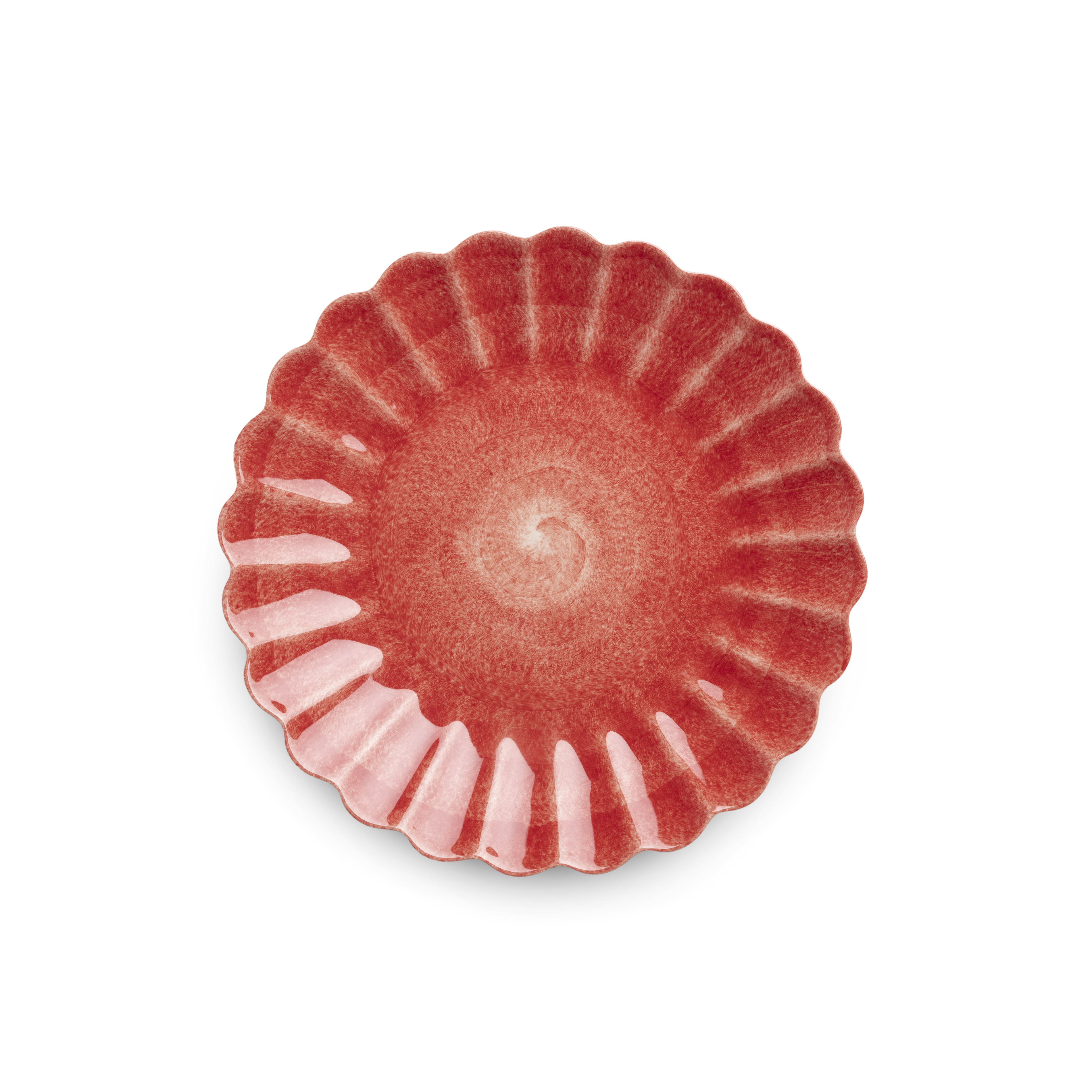 Red ceramic plate with scalloped edge on a white background
