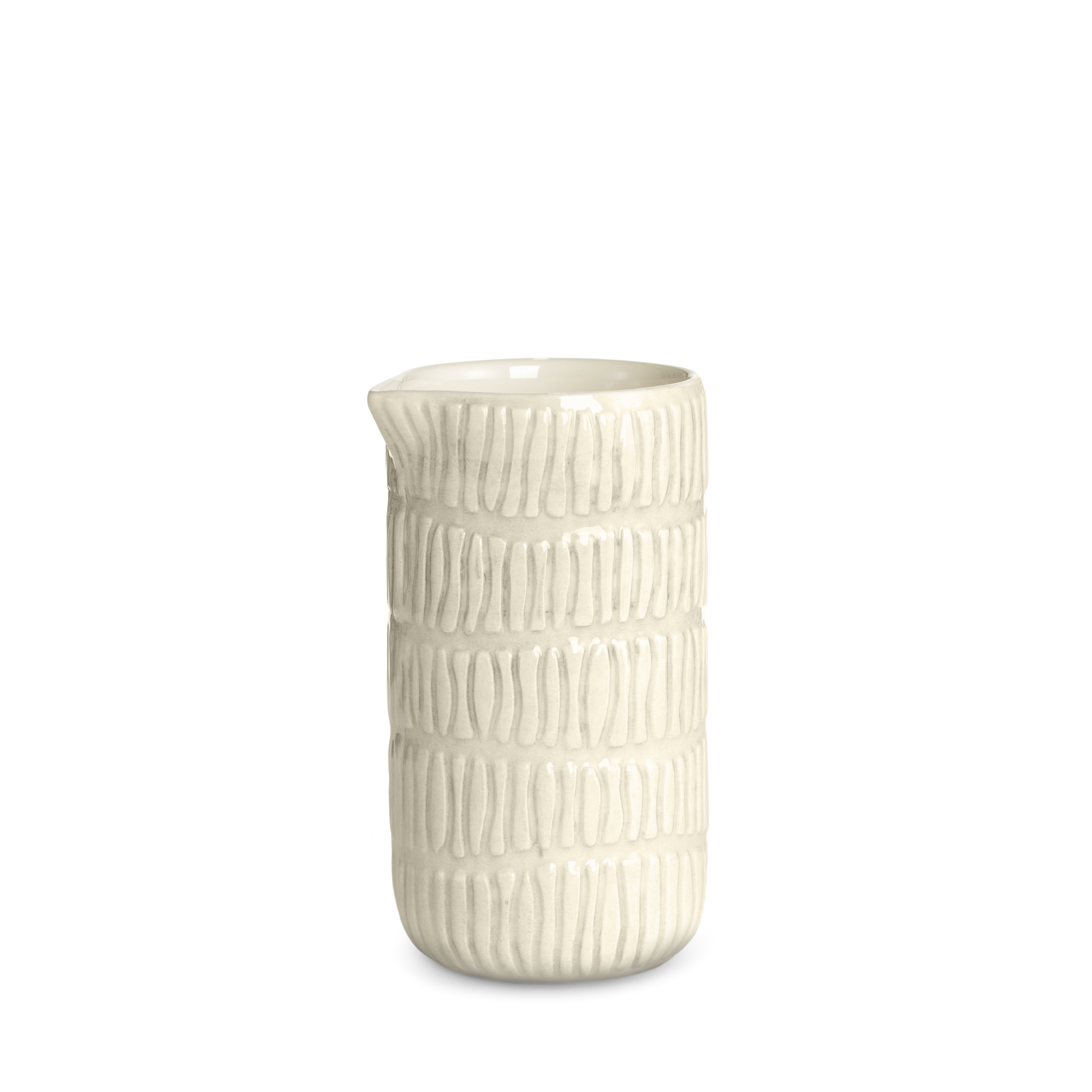 Sand ceramic jug with textured surface on a white background
