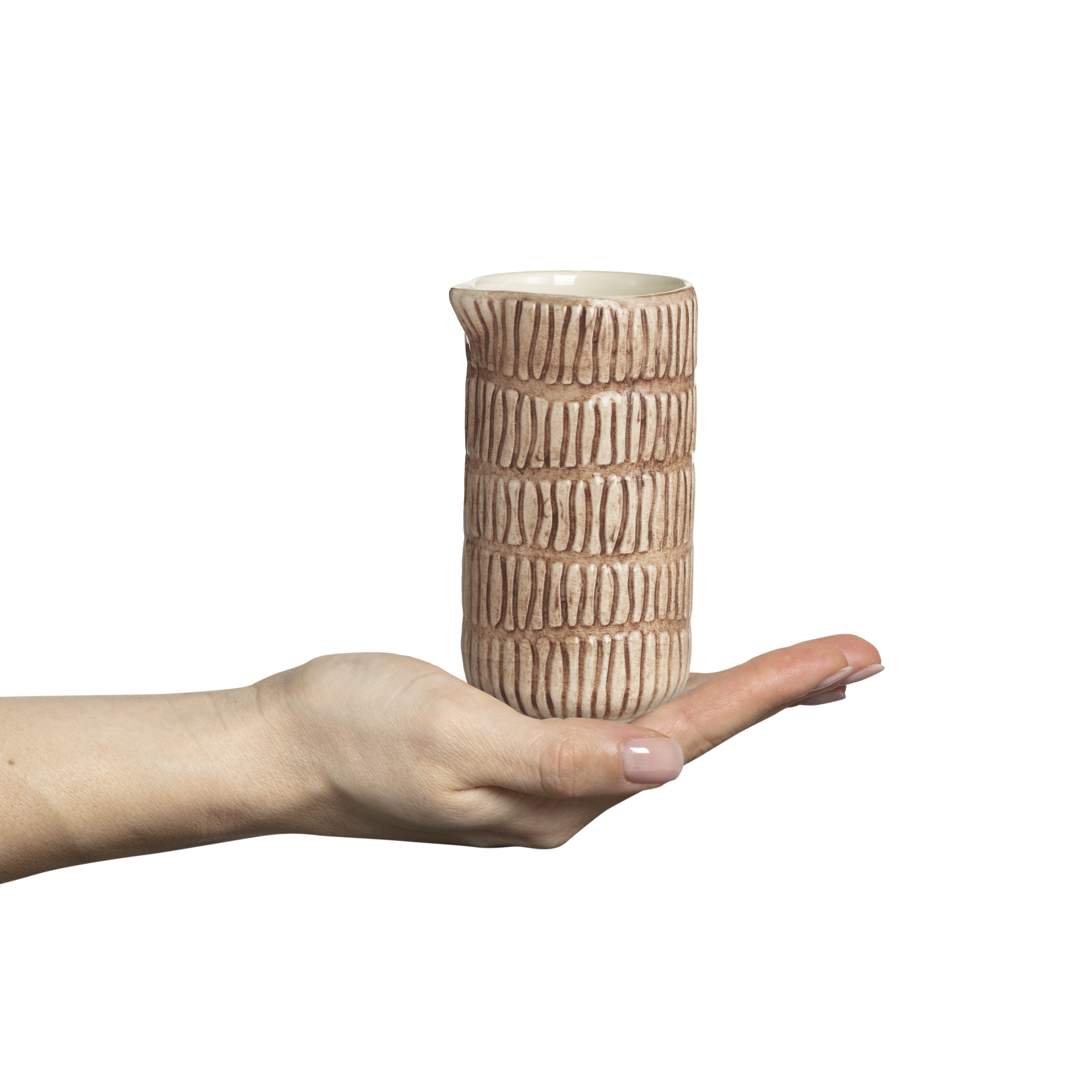 Hand holding a textured ceramic vase against a white background