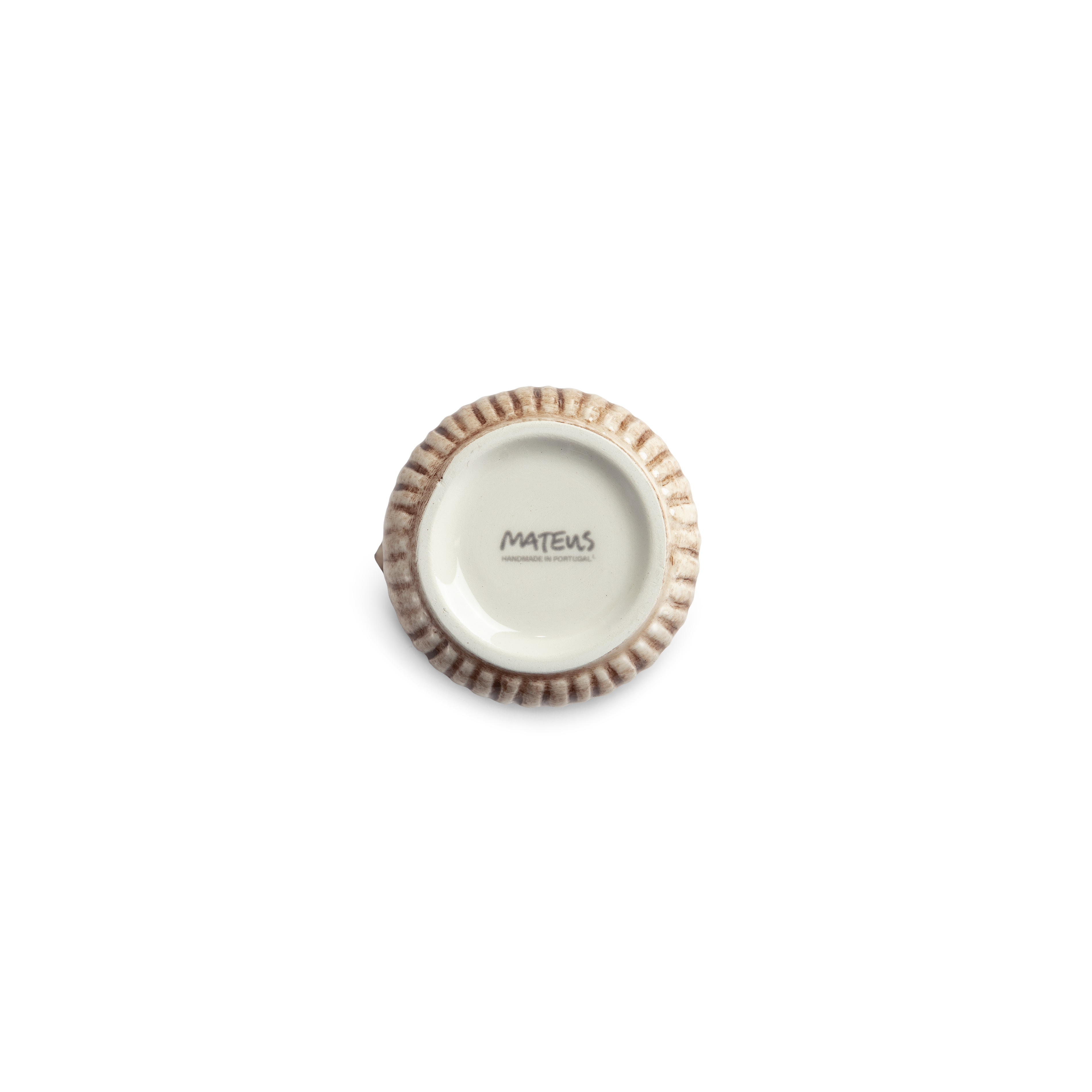 Bottom of a small jug with textured rim on a white background