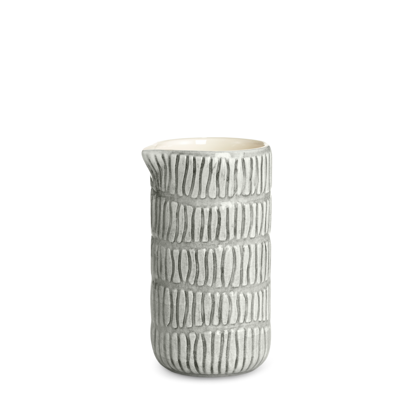 Ceramic jug with textured design on a white background