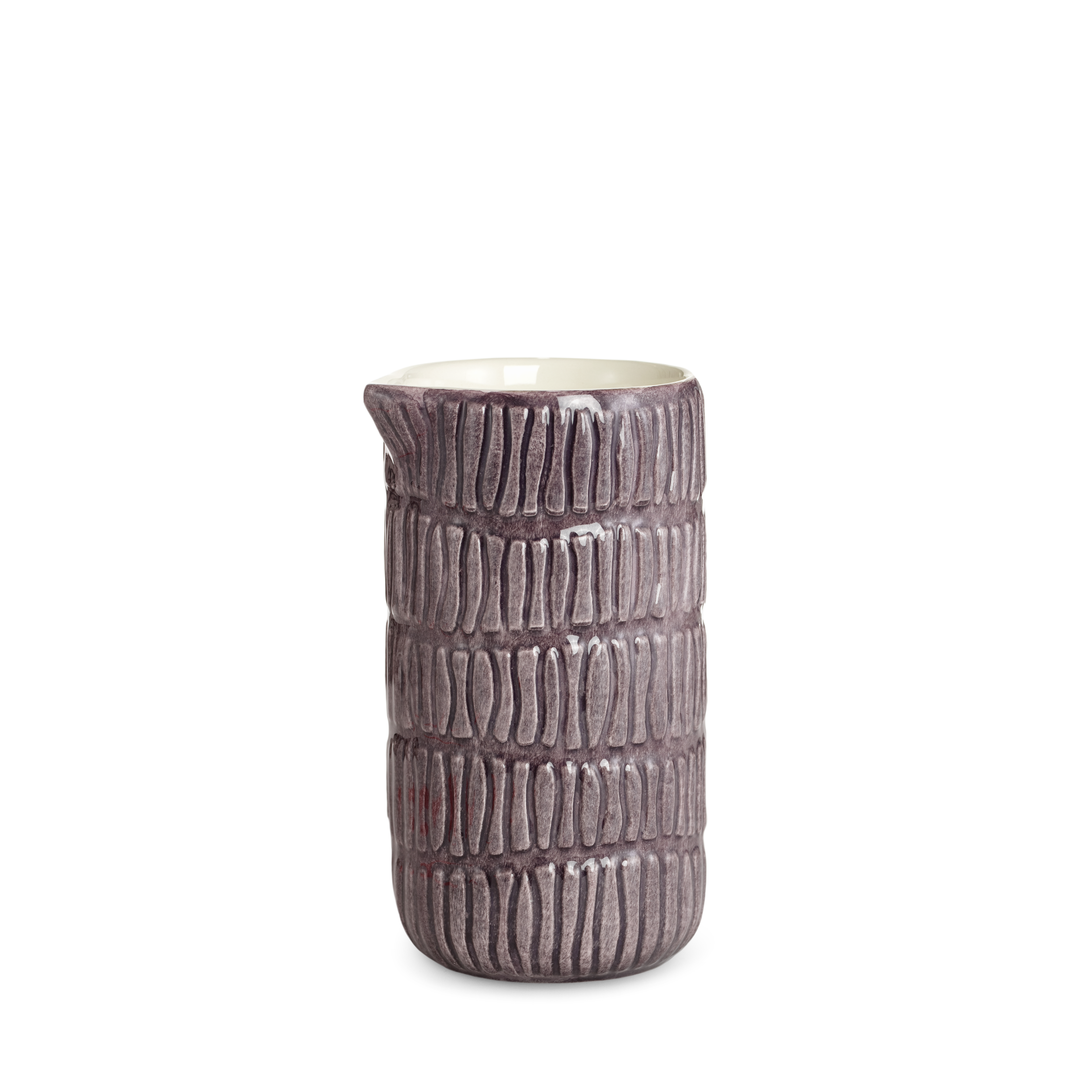 Textured ceramic jug on a white background