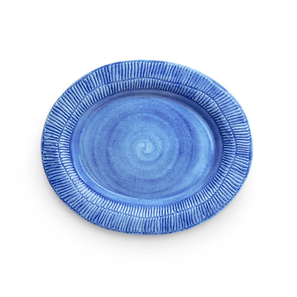 Blue ceramic plate with textured rim on a white background