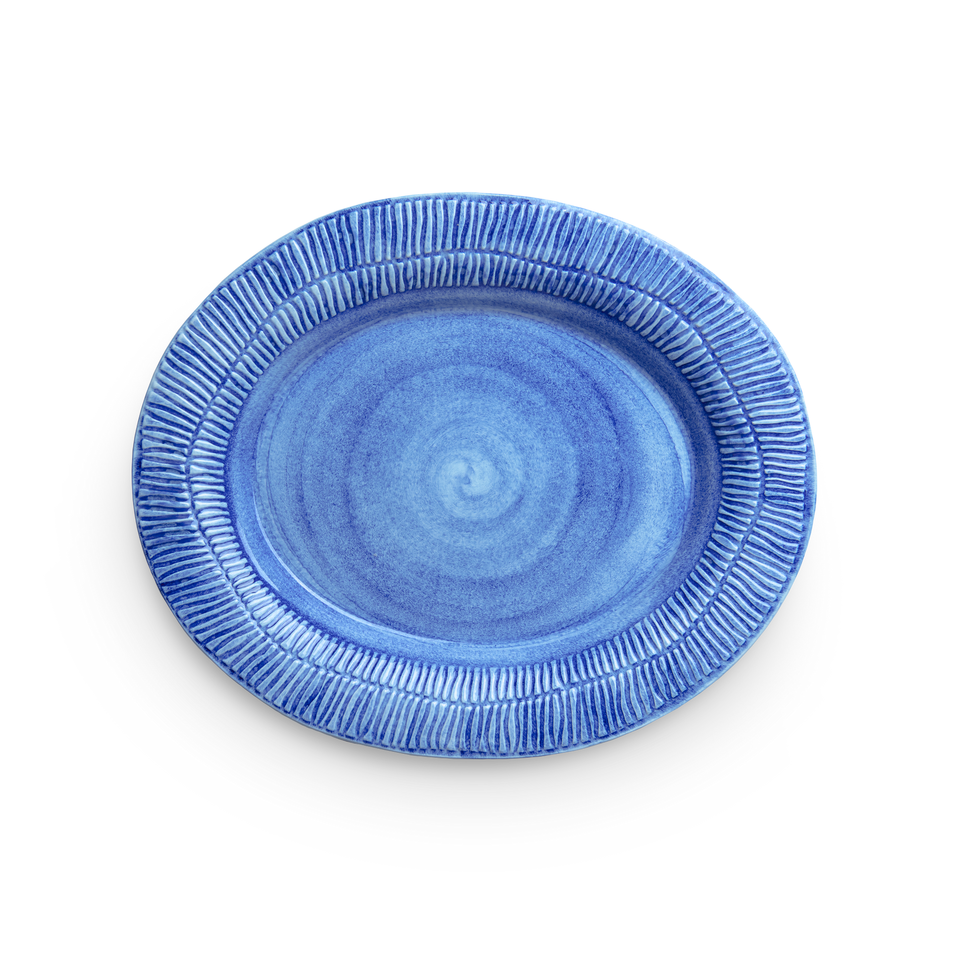 Blue ceramic plate with textured rim on a white background