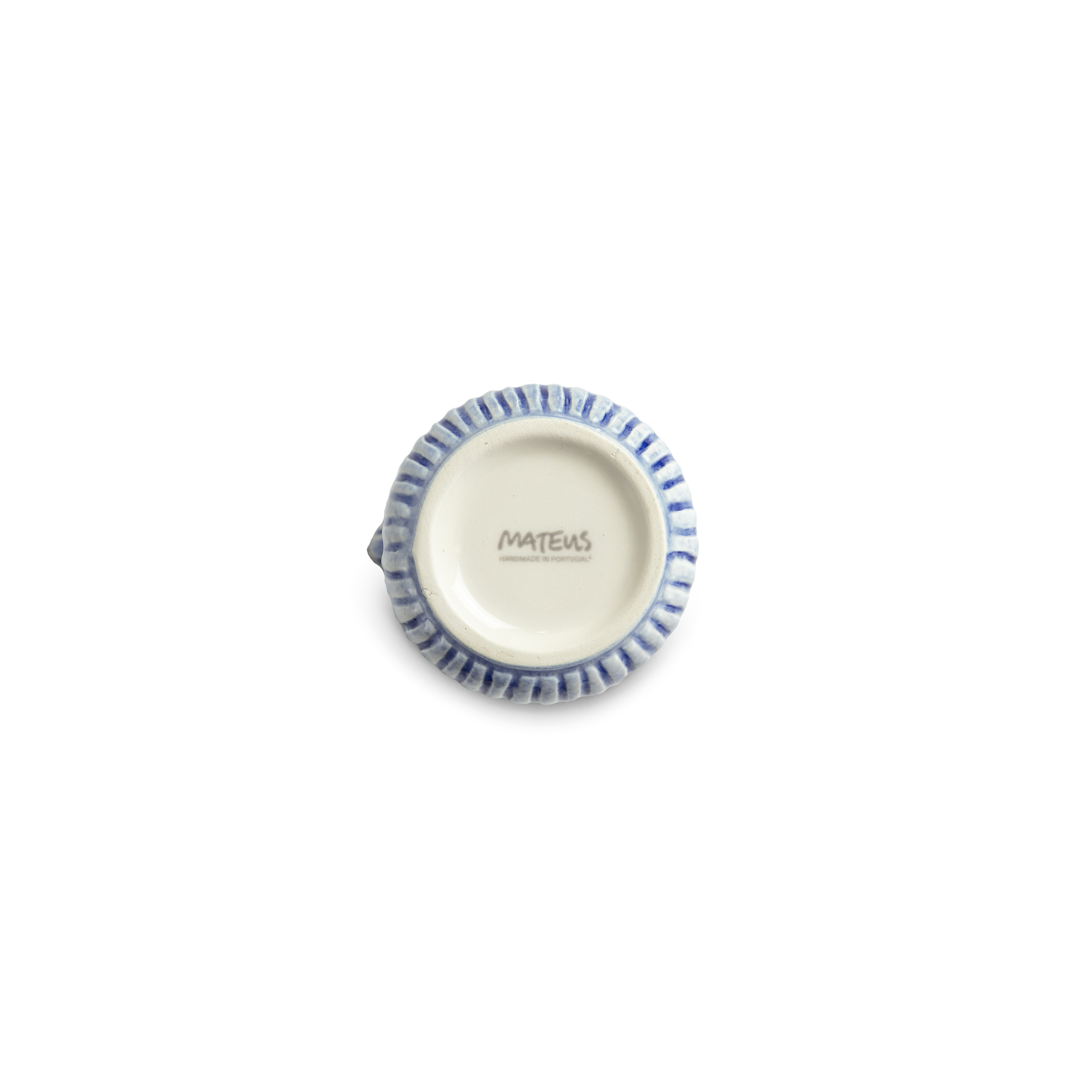 Small decorative jug bottom with textured rim on a white background