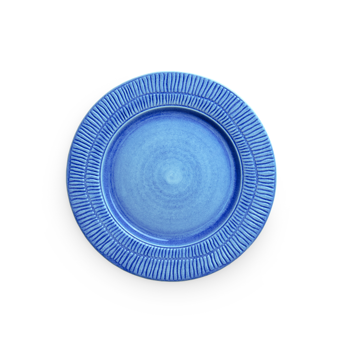 Blue ceramic plate with textured rim on a white background