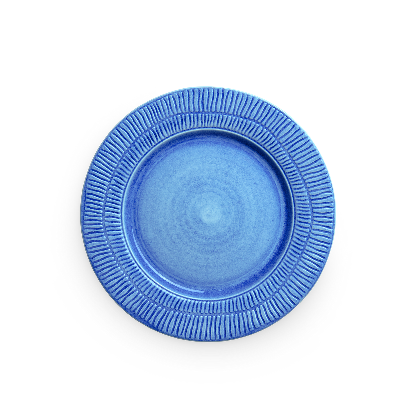 Blue ceramic plate with textured rim on a white background