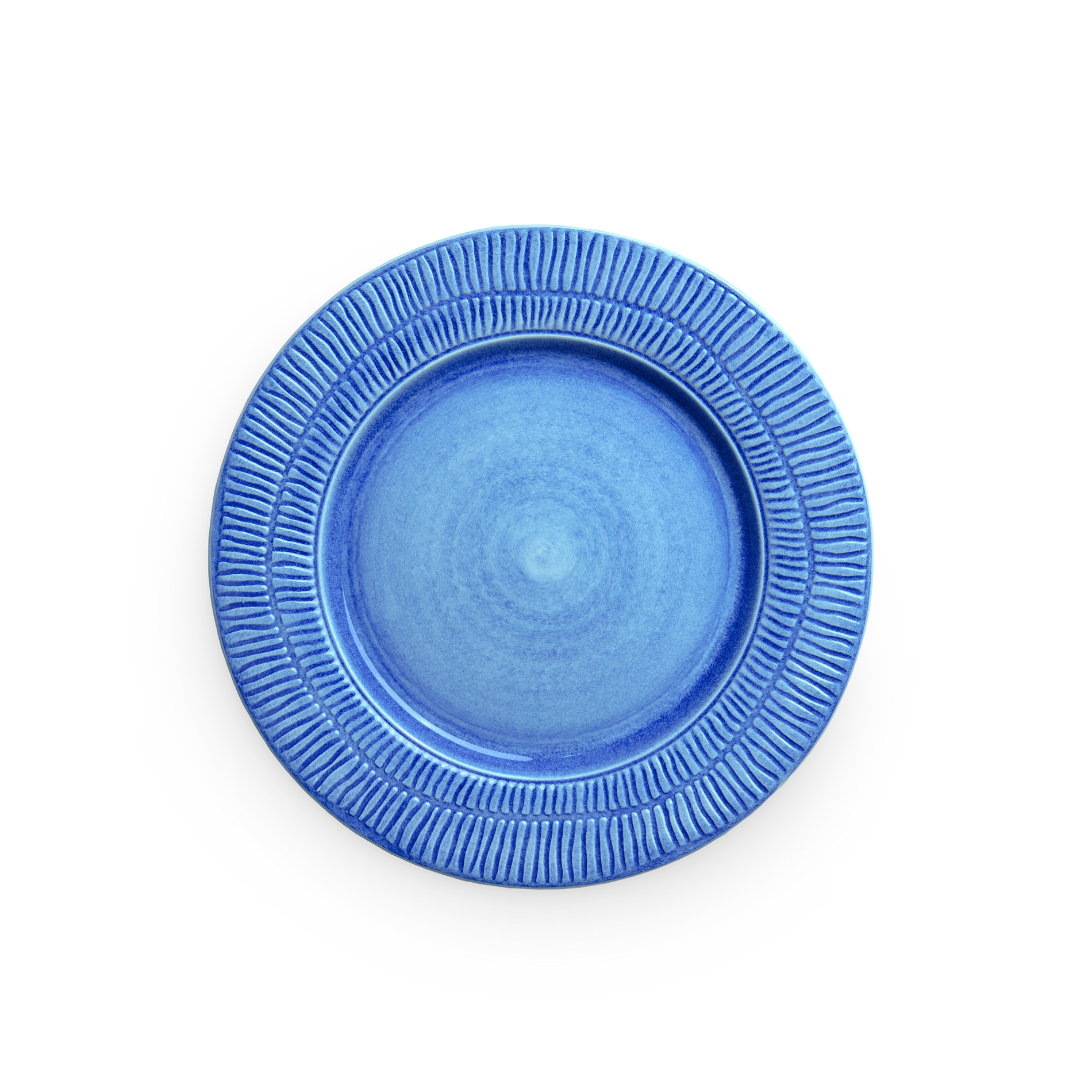 Blue ceramic plate with textured rim on a white background