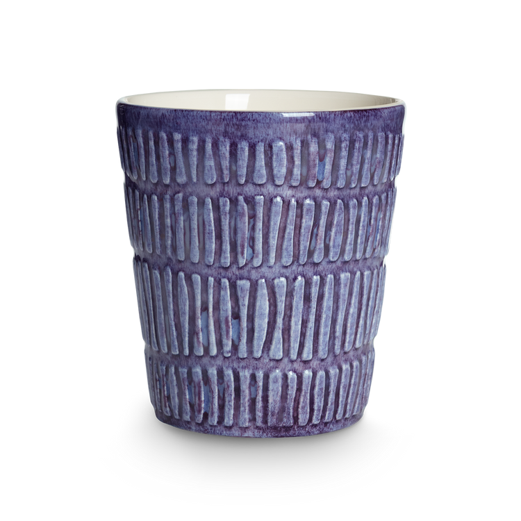 purple textured ceramic cup on a white background