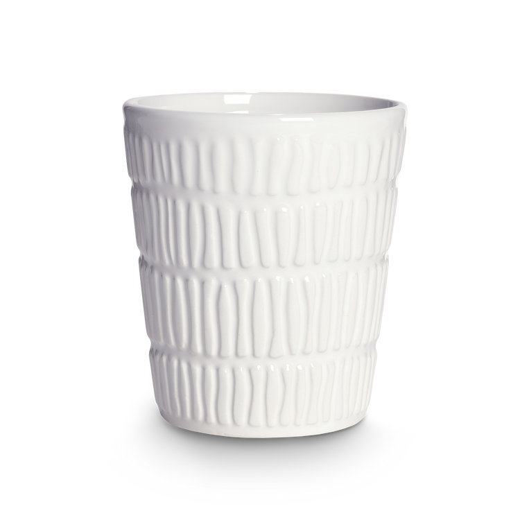 White textured ceramic cup on a white background
